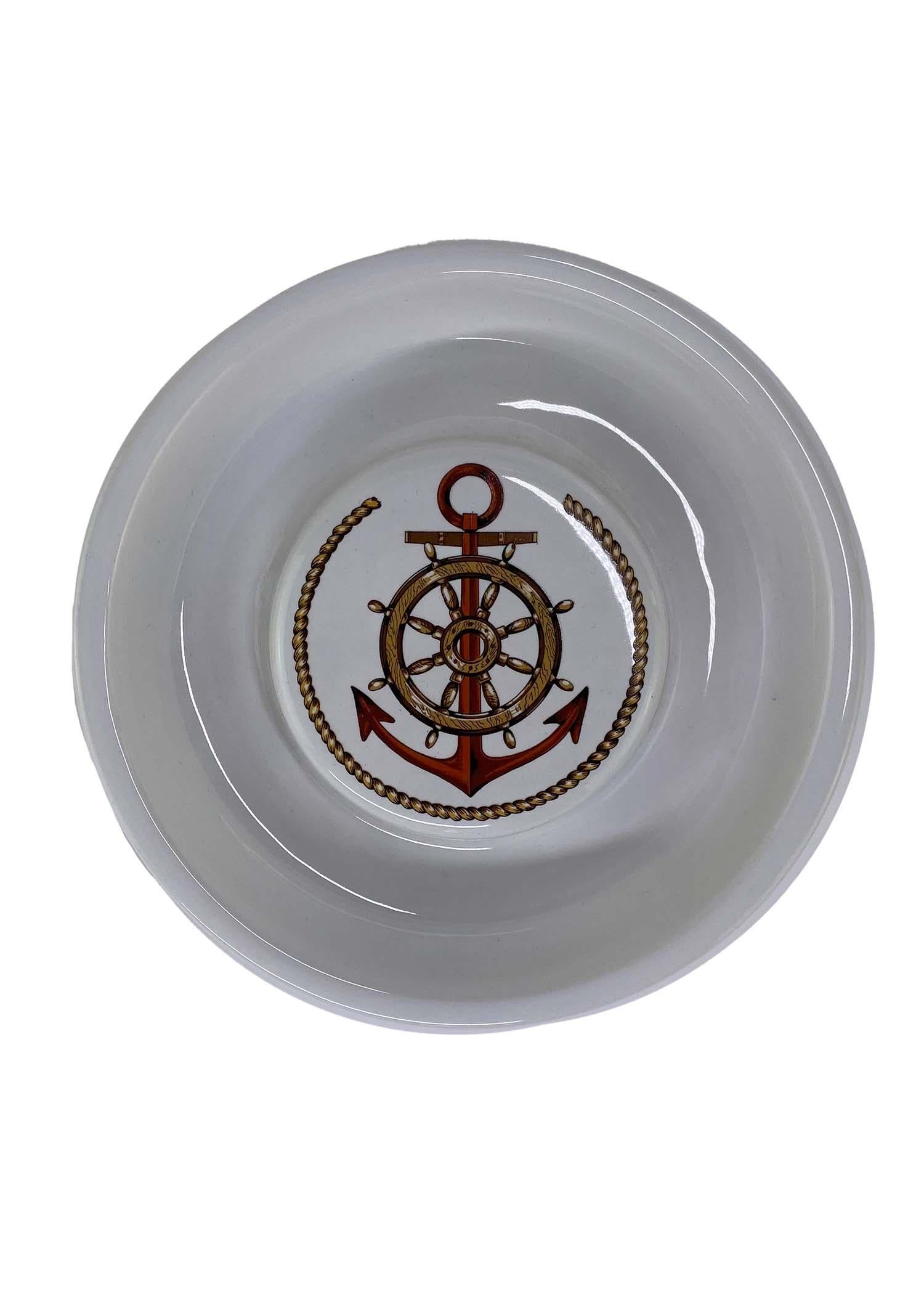 TheRealList presents: a rare piece of vintage Gucci home decor. This porcelain ashtray has never been used, making it a perfect gift for any Gucci lover to display. The top piece is printed with two 'Gucci' logos and eight nautical flags. The bottom