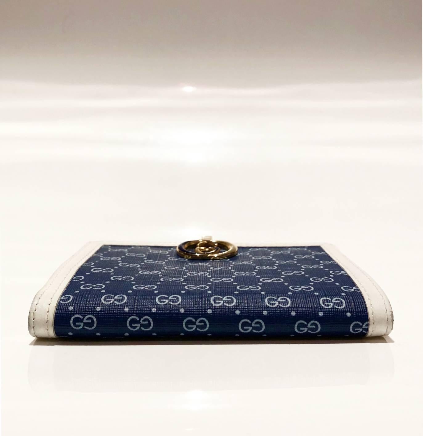 FREE UK and WORLDWIDE DELIVERY 

Vintage Gucci wallet in Blue and white monogram canvas, GG (black and gold) interlocking clutch closure, white leather and gold-ware, interior coin compartment with clutch closure and additional card
