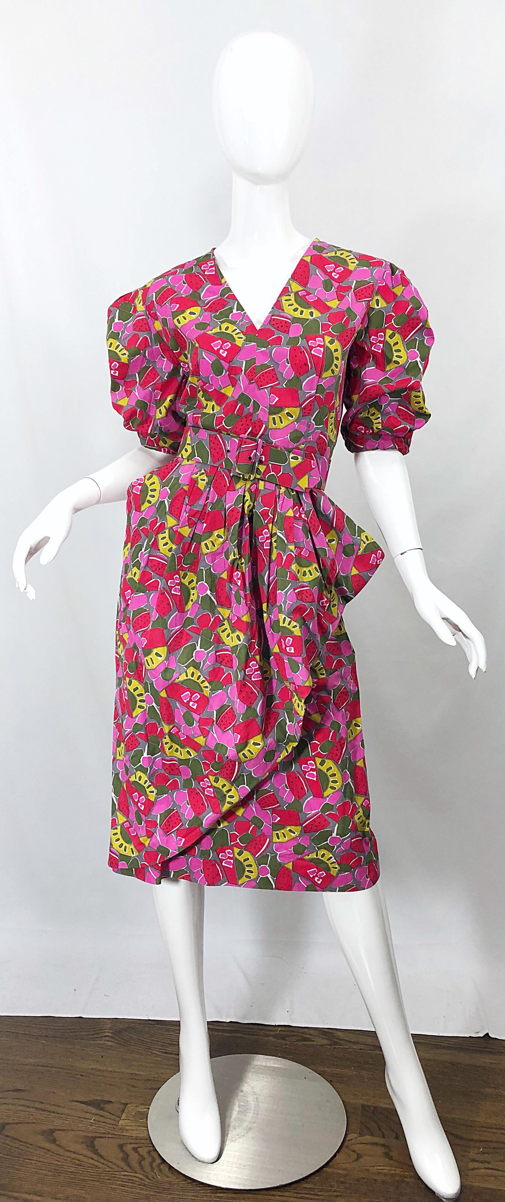 Chic 1980s GUY LAROCHE novelty fruit print Avant Garde cotton belted dress! Stylish puff sleeves, with a side peplum. Pockets at each side of the hips. Hidden zipper up the back with 
hook-and-eye closure. Prints of watermelon, kiwi, strawberries,