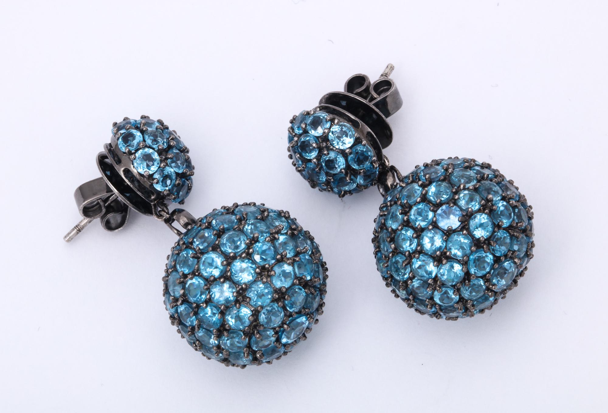 One Pair Of Ladies Double Sphere Drop Earrings Created In 18kt Oxidized White Gold. Earrings Are Paved With Numerous Faceted Blue Topaz Stones Weighing Approximately 15 Carats Total Weight. Earrings Move When Worn To Capture Full Light Of The