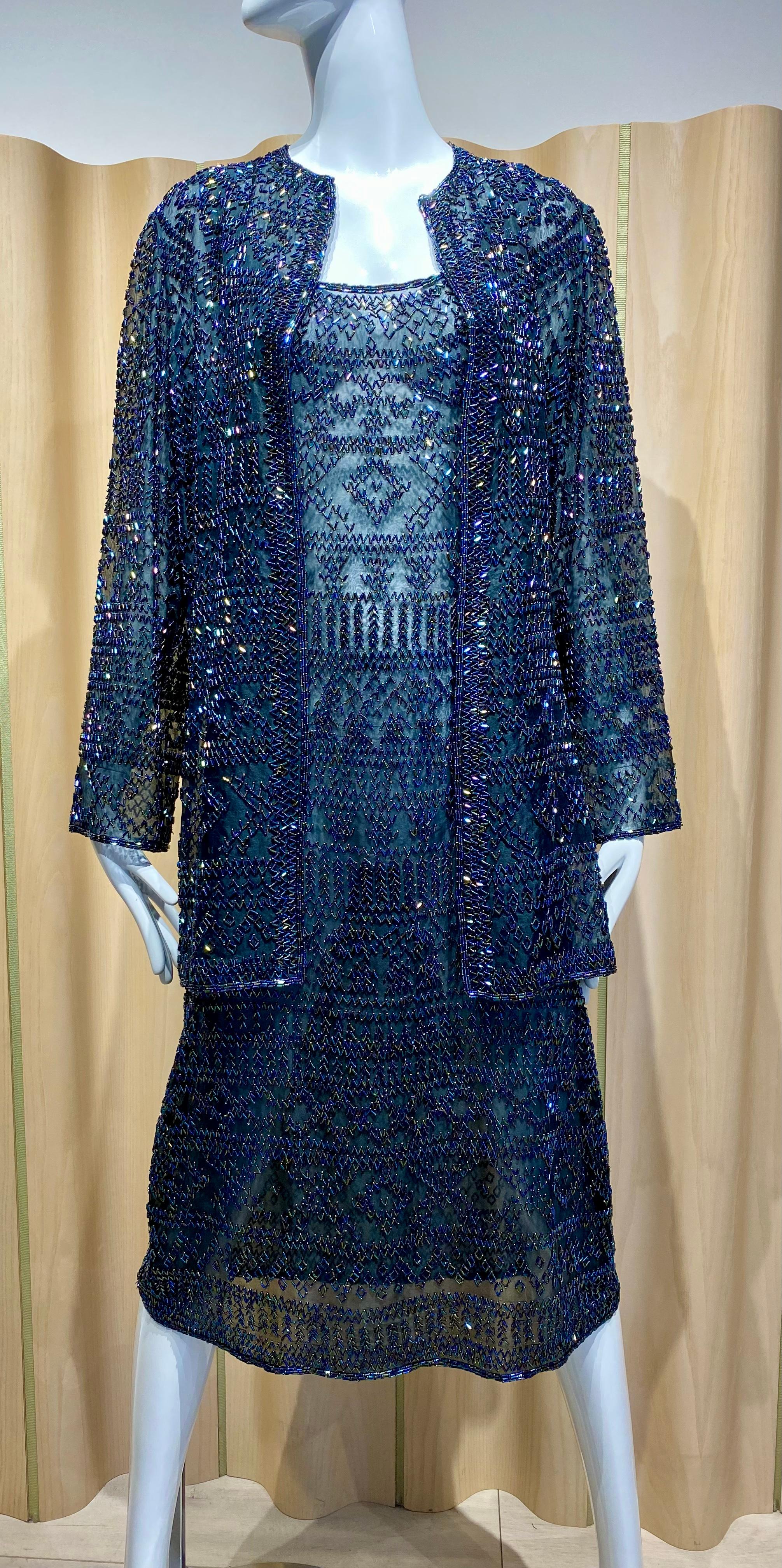 1980s Halston Black beaded sleeveless cocktail dress with cardigan jacket.
Dress and jacket weigh around 5lb
Dress and Jacket in great condition. ( see photo from WWD article) attached
Size : Medium (8 or 10) see measurement below :
Dress 
bust -