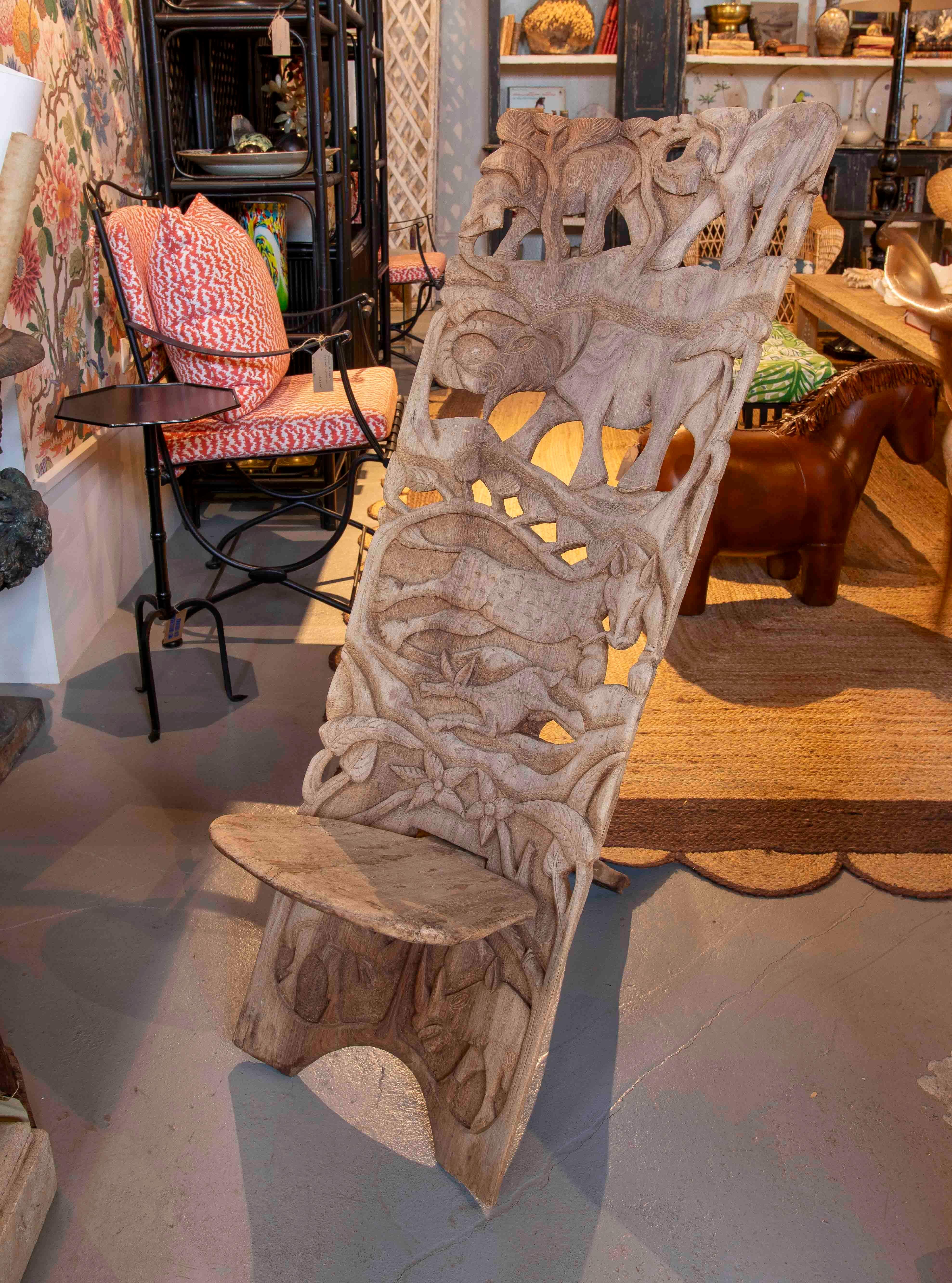African 1980s Handcrafted Chair Carved in Wood with Wildlife Motifs For Sale