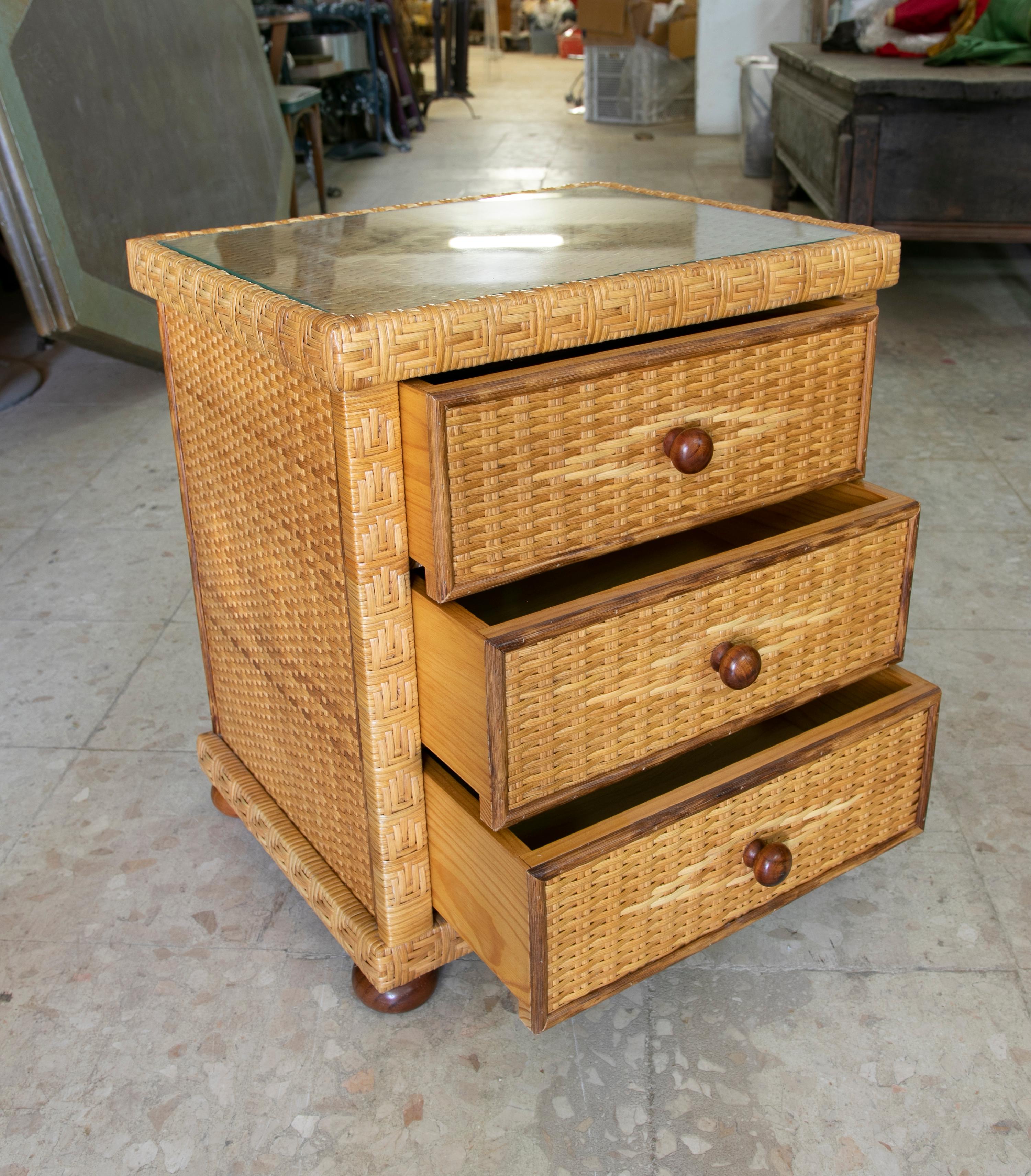 1980s Handmade wicker sidetable with three drawers.
