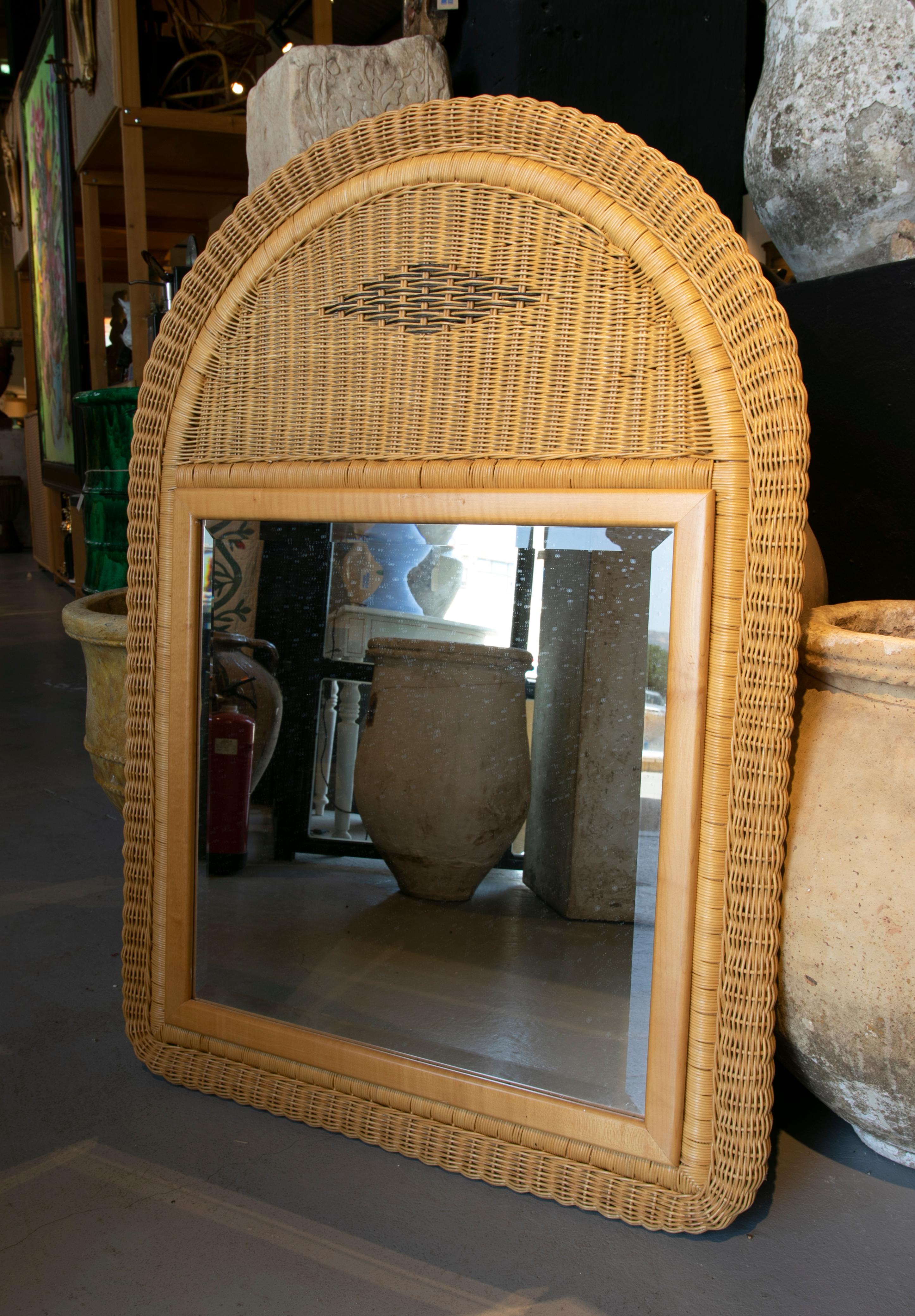 1980s handmade wicker wall mirror.