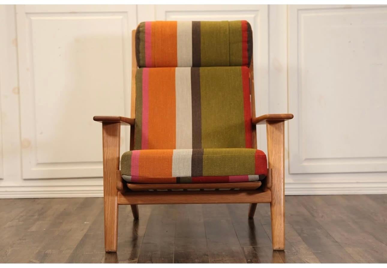 Classic Hans J. Wegner GE 290 Armchair for Getama, Made in Denmark.High back lounge chair in rift-sawn white oak,, original sprung cushions , bright and colorful maharam upholstery, Extremely comfortable,, Superior quality and construction,, Retains
