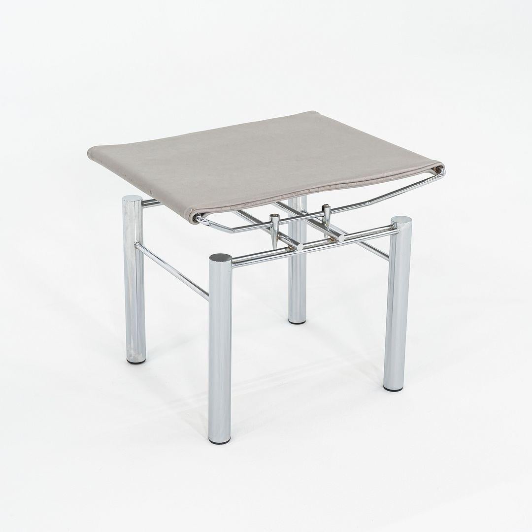 This is an 8600 Series stool or ottoman designed by Hans Ullrich Bitsch for Kusch & Co.. This particular example was produced in Germany in the 1980s. The stool features a tubular metal frame and an upholstered seat in grey leather.

This piece