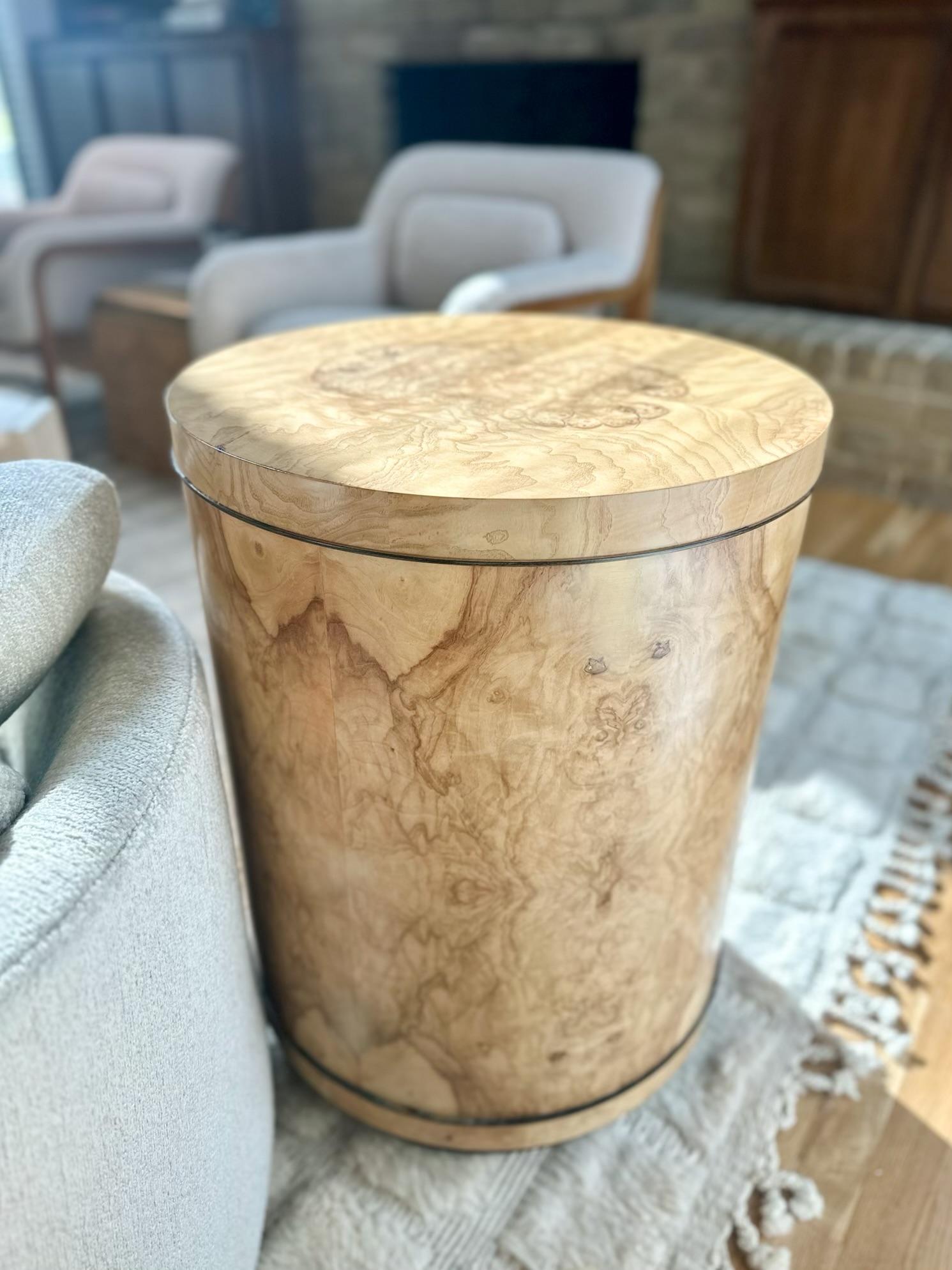 Fantastic burlwood drum side table by Henredon, c.1980s. For decades, the Henredon name has been synonymous with fine furniture, and their Scene Two collection exemplifies this best. With solid ash casing, olivewood burl veneer, and ebonized plinth