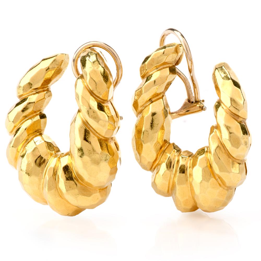 hese chic designer Henry Dunay earrings are crafted in solid 18 karat yellow gold, weighing 33.1 grams measuring 34mm long x 26mm wide. Displaying the classic Hand hammered gold technique and swirl pattern. 
Secure with clip ons and remain in