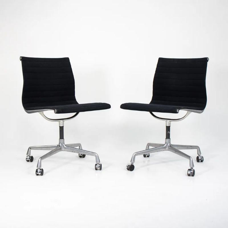 This is a single (two chairs are available, though the price listed is for each chair) Eames Aluminum Group armless side chair, designed by Charles & Ray Eames for Herman Miller in 1958. This particular chair was manufactured circa mid 1980s and is
