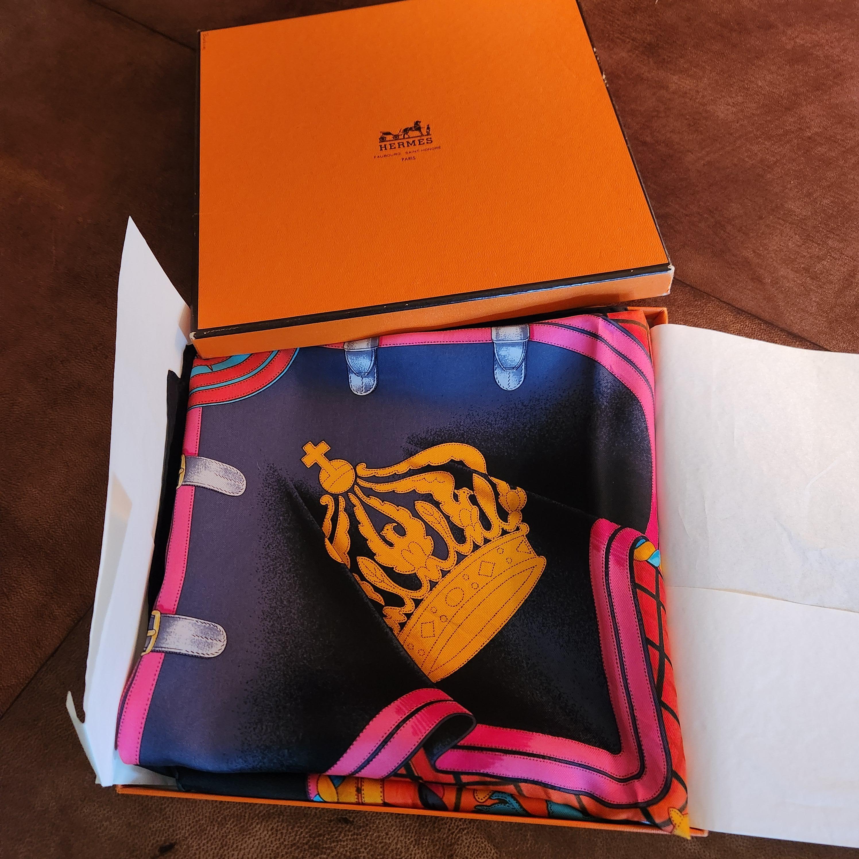 AMBIANIC presents
Hermès Silk Scarf Grande Tenue by designer Henri D'Origny
features Émile Hermès monogram. 
approximately 35 inches
Preowned original vintage condition folded and boxed
Retains original packaging