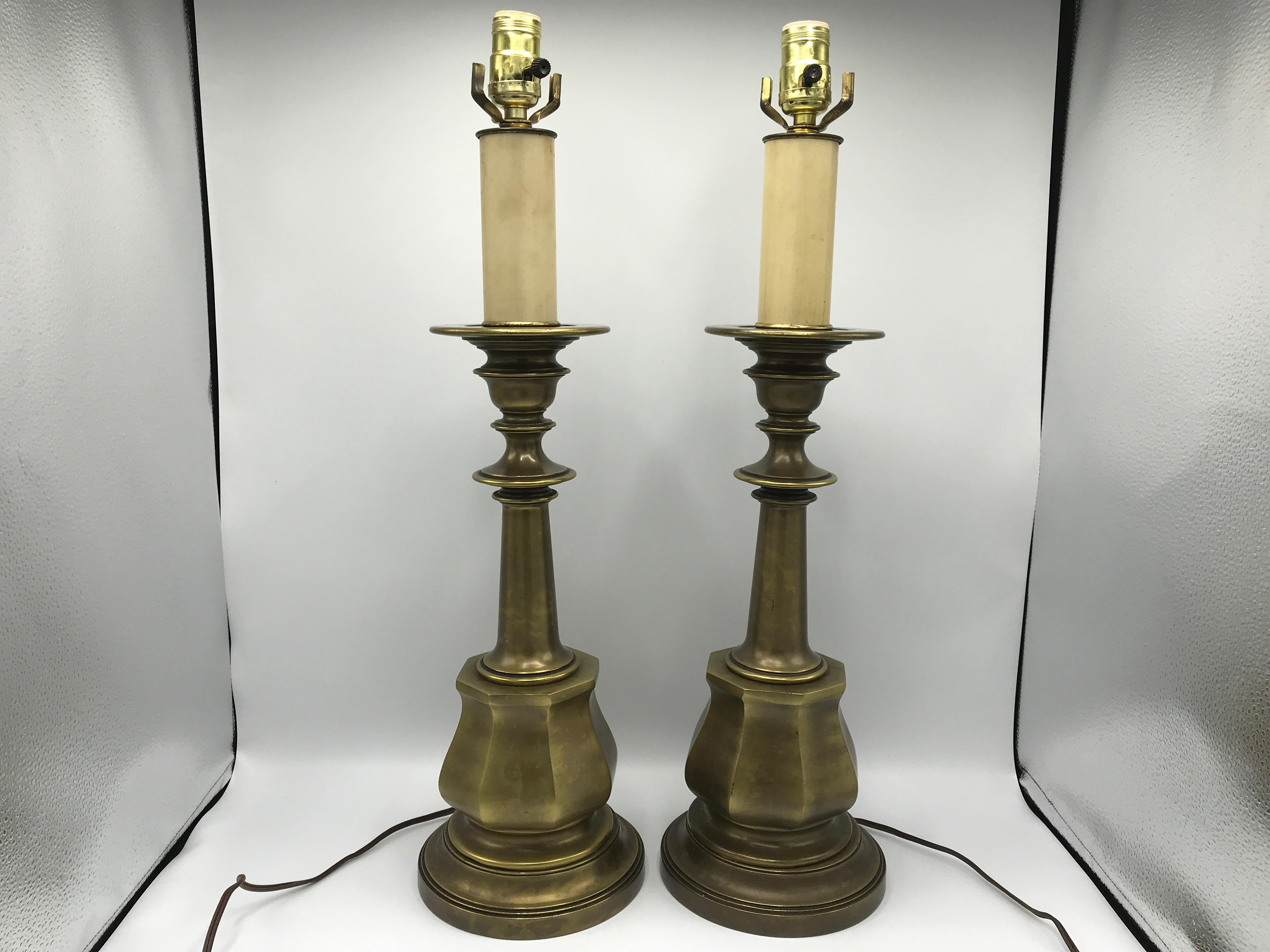 Listed is a fabulous, pair of oversized Hollywood Regency, 1980s brushed brass candlestick lamps. The pair has a lovely all-over, patina. Heavy, weighing nearly 18lbs for the pair.