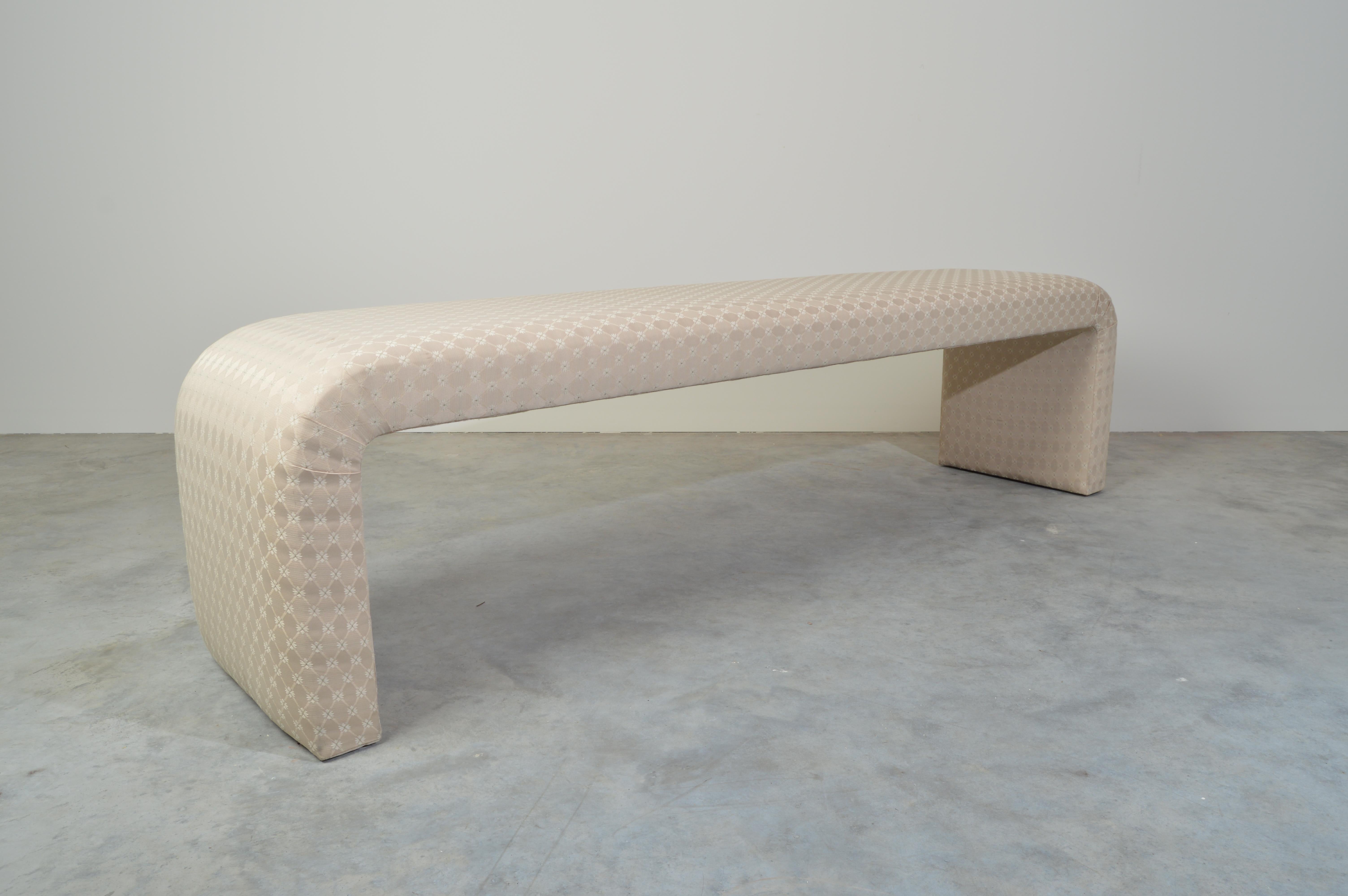 Exceptionally lithe 1980s contemporary upholstered waterfall bench of solid bent wood constructed interior. Suitable for a variety of settings. Generous 74