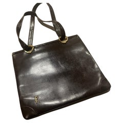 1980s Iconic Brown Leather and Brass Shoulder Bag by Roberta di Camerino