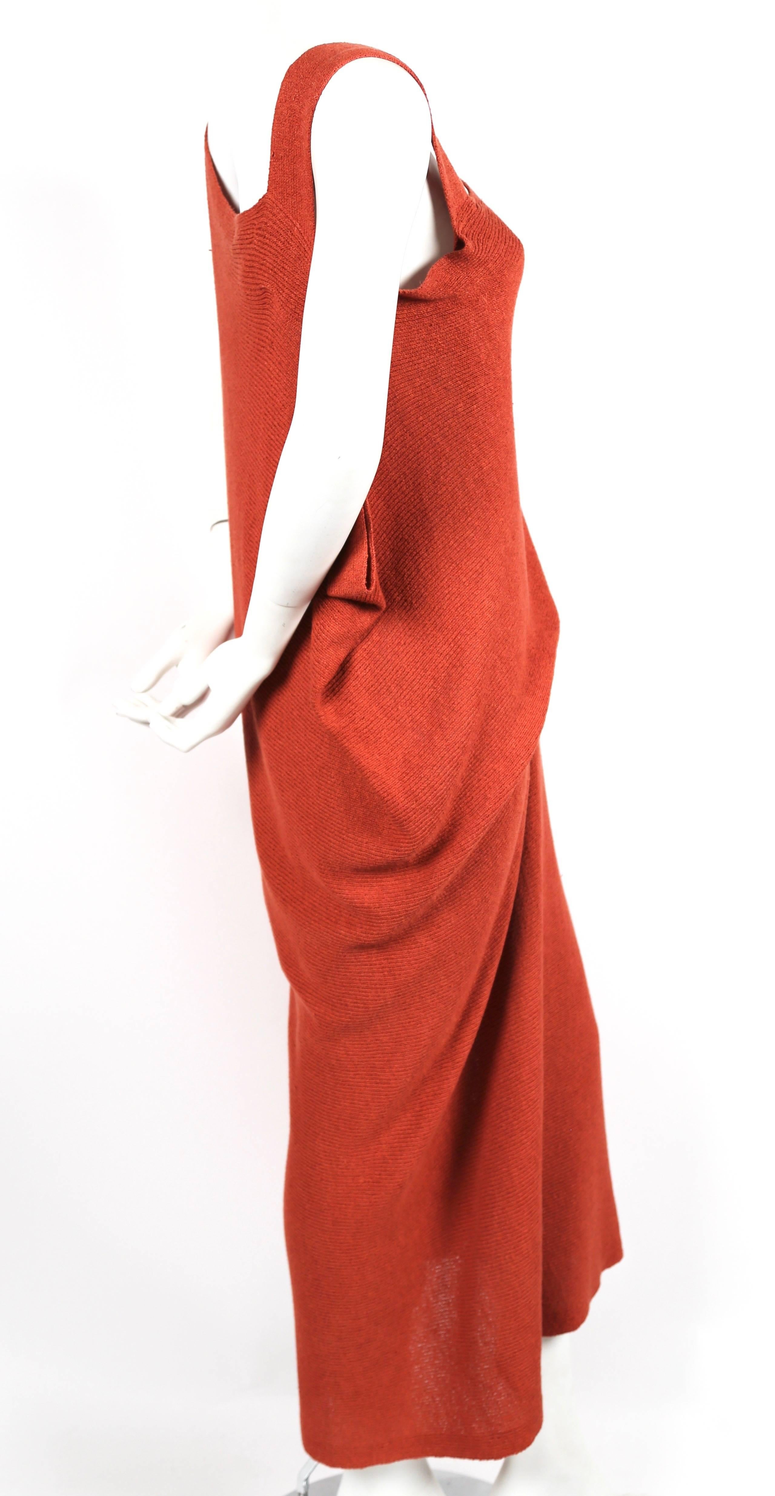 Asymmetrically draped knit dress from Issey Miyake dating to the early 1980's.  Labeled a size M however this dress fits a wide variety of sizes due to draped cut. Approximate measurements: hips 40