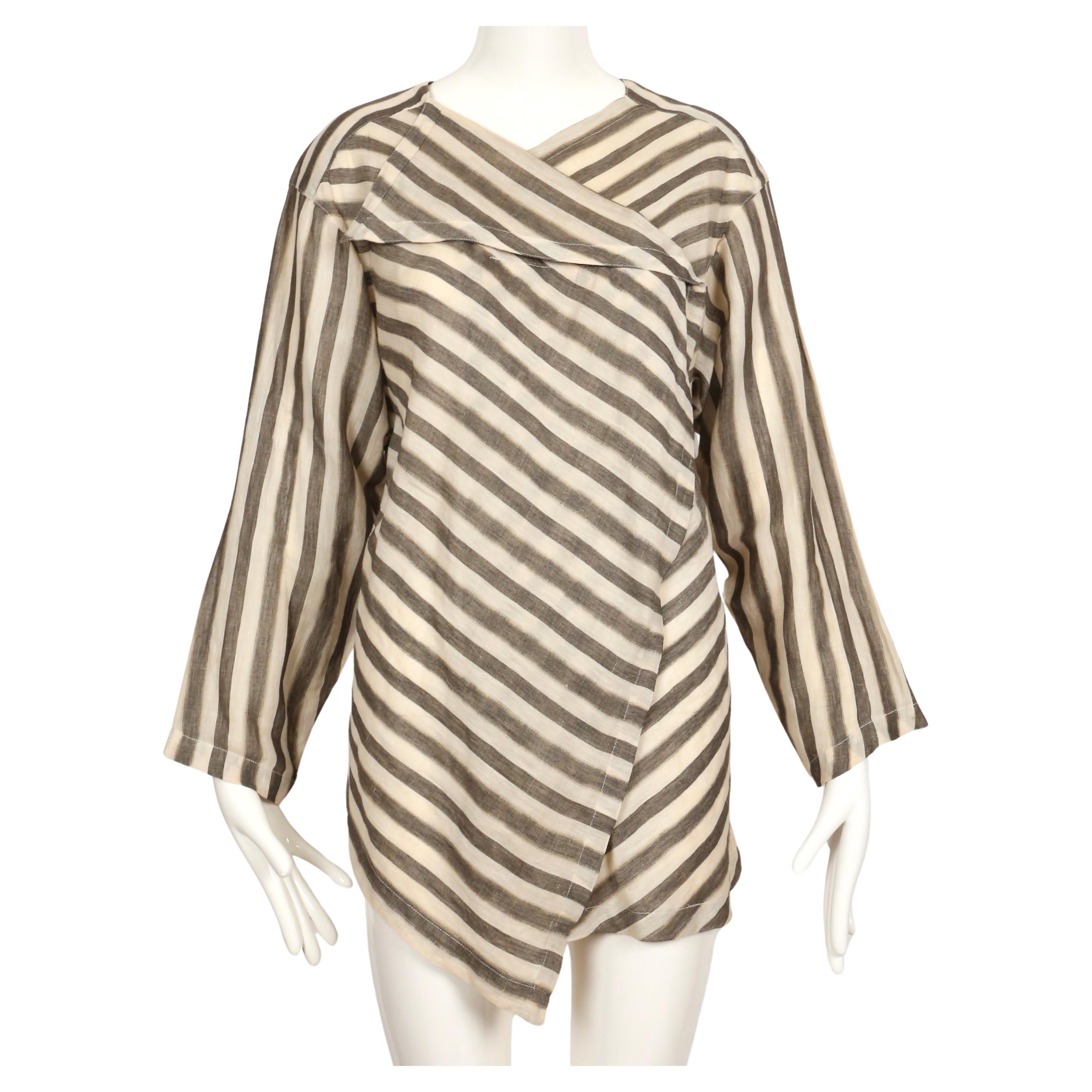 Very lightweight striped cotton top with asymmetrical cut designed by Issey Miyake dating to the early 1980's. Japanese size 9 however this will fit many sizes due to the oversized cut.  Cotton blend fabric. Made in Japan. Very good condition. 