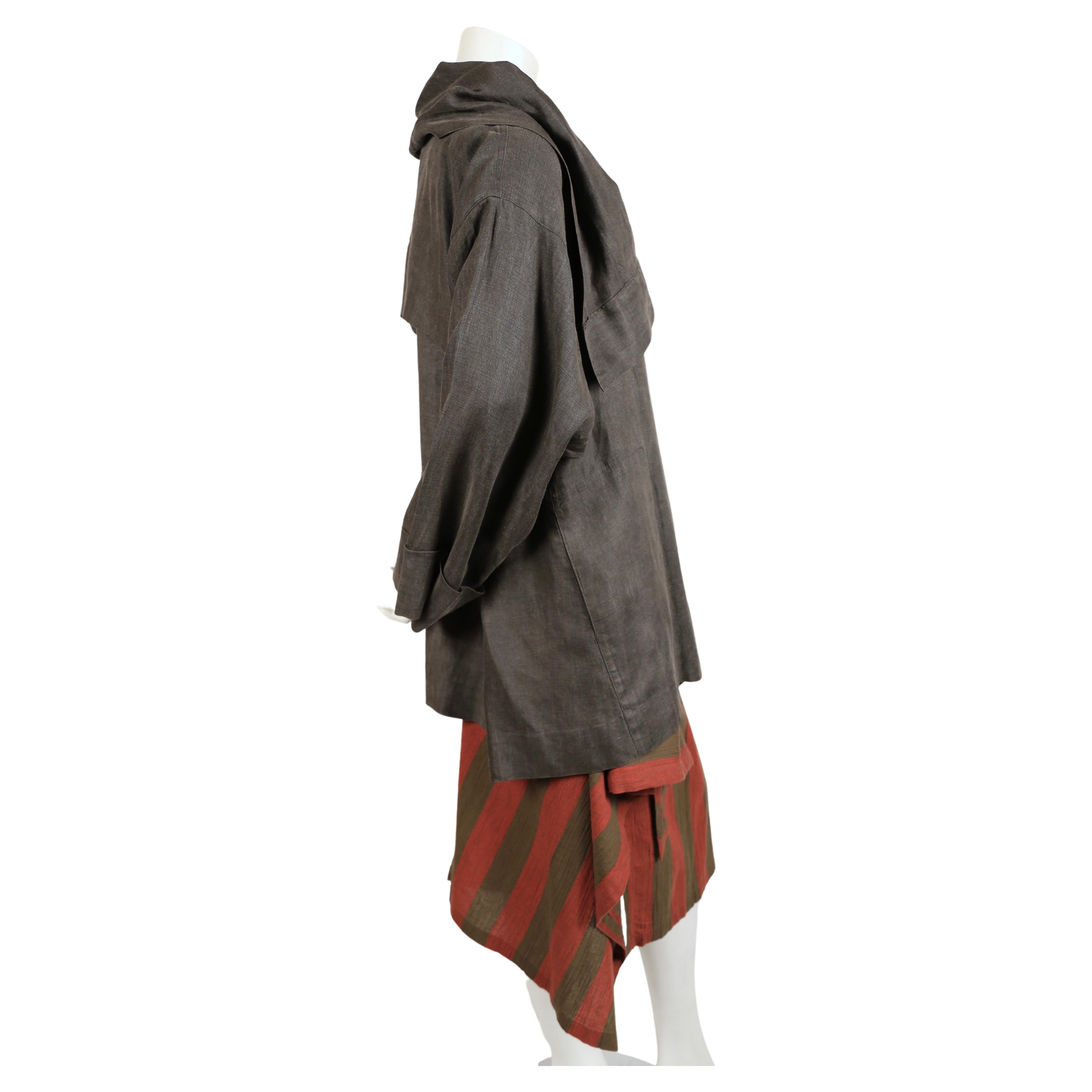Draped grey linen jacket with unique khaki button closure paired with a khaki and dark terra cotta color cotton/linen blend skirt from Issey Miyake dating to the early 1980's. Sizing is flexible with the jacket however it is labeled a size 'M'. The