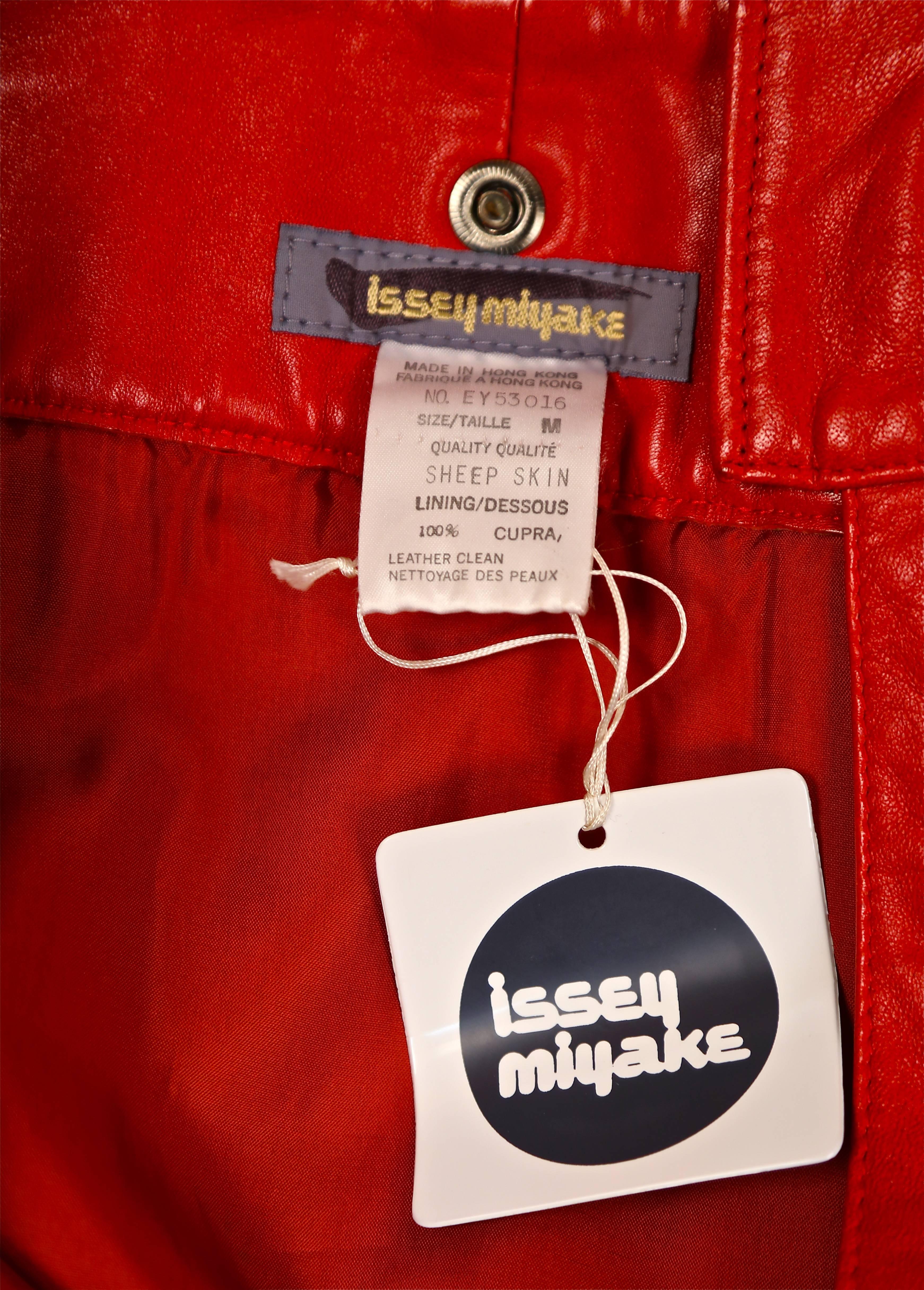 1980's ISSEY MIYAKE unworn red leather mini skirt with oversized studs For Sale 2