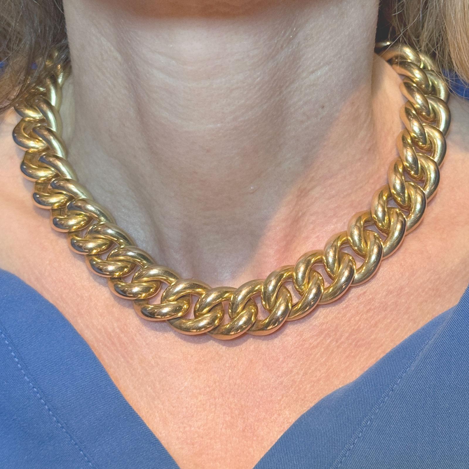 This classic 1980s Italian 14 karat yellow gold curb link choker necklace exudes timeless elegance and sophistication. The necklace measures 16.5 inches in length, making it a perfect fit for a choker-style look. Each curb link is finely crafted,