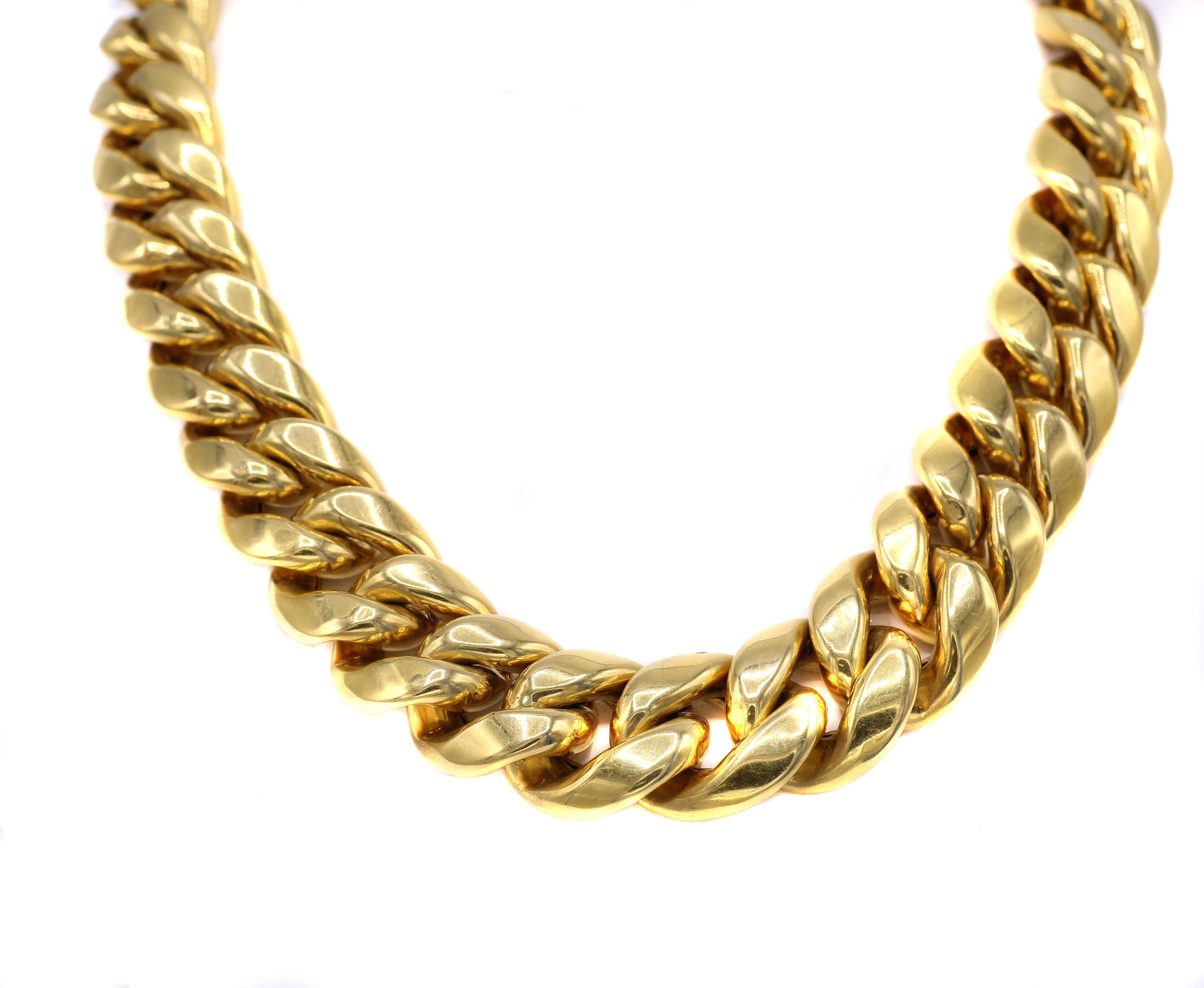 Fashionable chic Italian 1980s 18 karat yellow gold curb link choker necklace with a minimal graduation of width ranging from 0.75 inches in the center to 0.6 inches at the ends. The hollow gold links make this necklace not too heavy on the neck