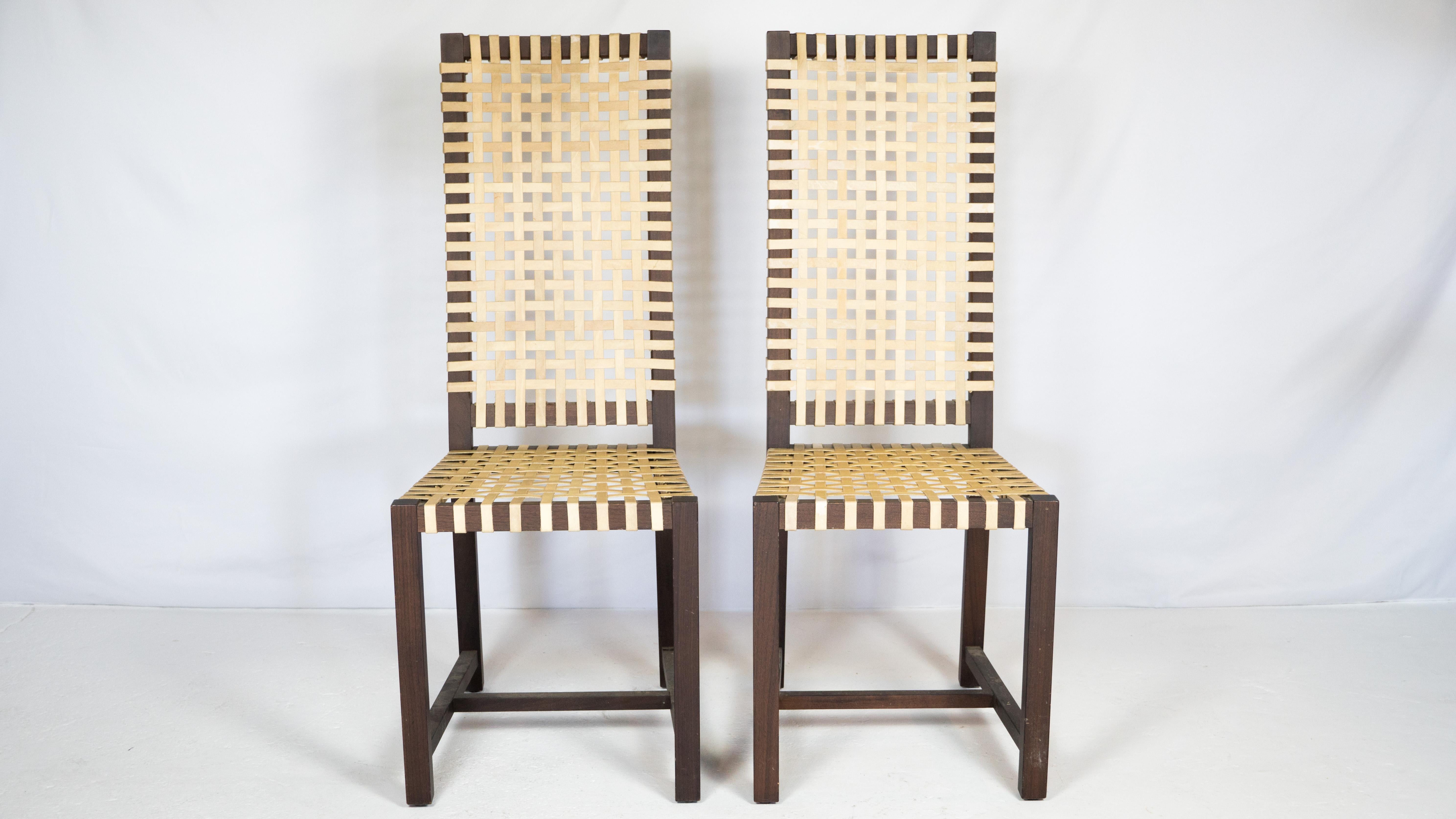 Pair of Italian architectural 'Otto 121' high back side chairs designed by Paola Navone for Gervasoni, circa 1990s. Perfect height for a writer's desk or corner accent chair or extra dining chairs. Woven straps support the seat and backrest. Frame