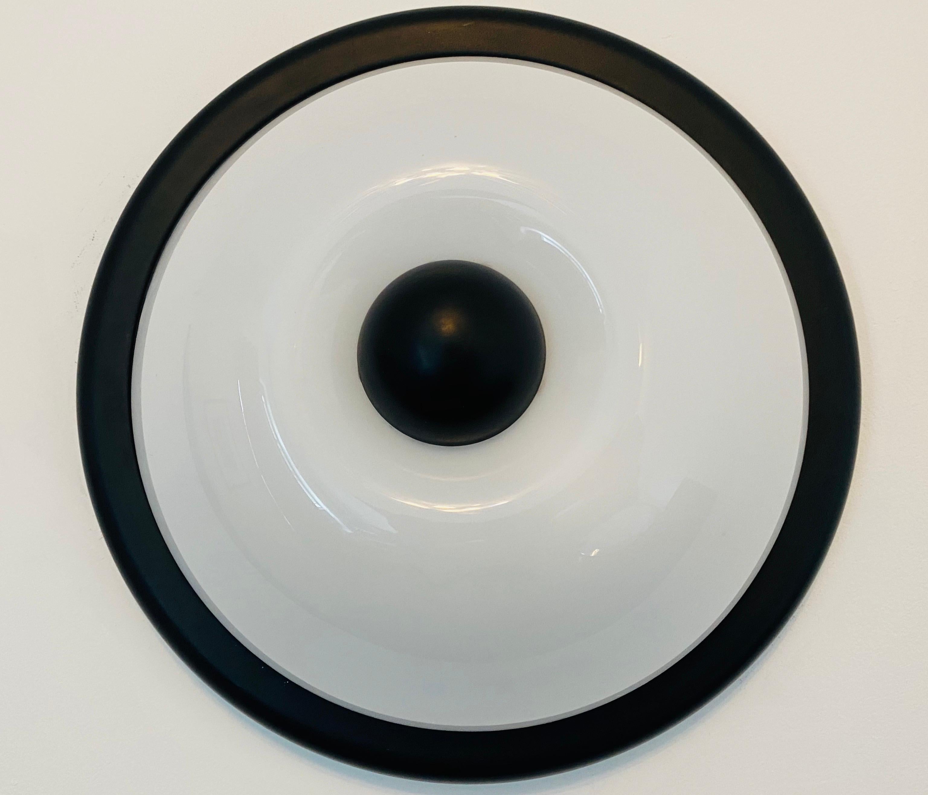 A 1980s high impact flush ceiling or wall light composed a black enamel frame and finial and a white resin shade. Made by the Italian lighting maker, Fabbian. Rewired.
