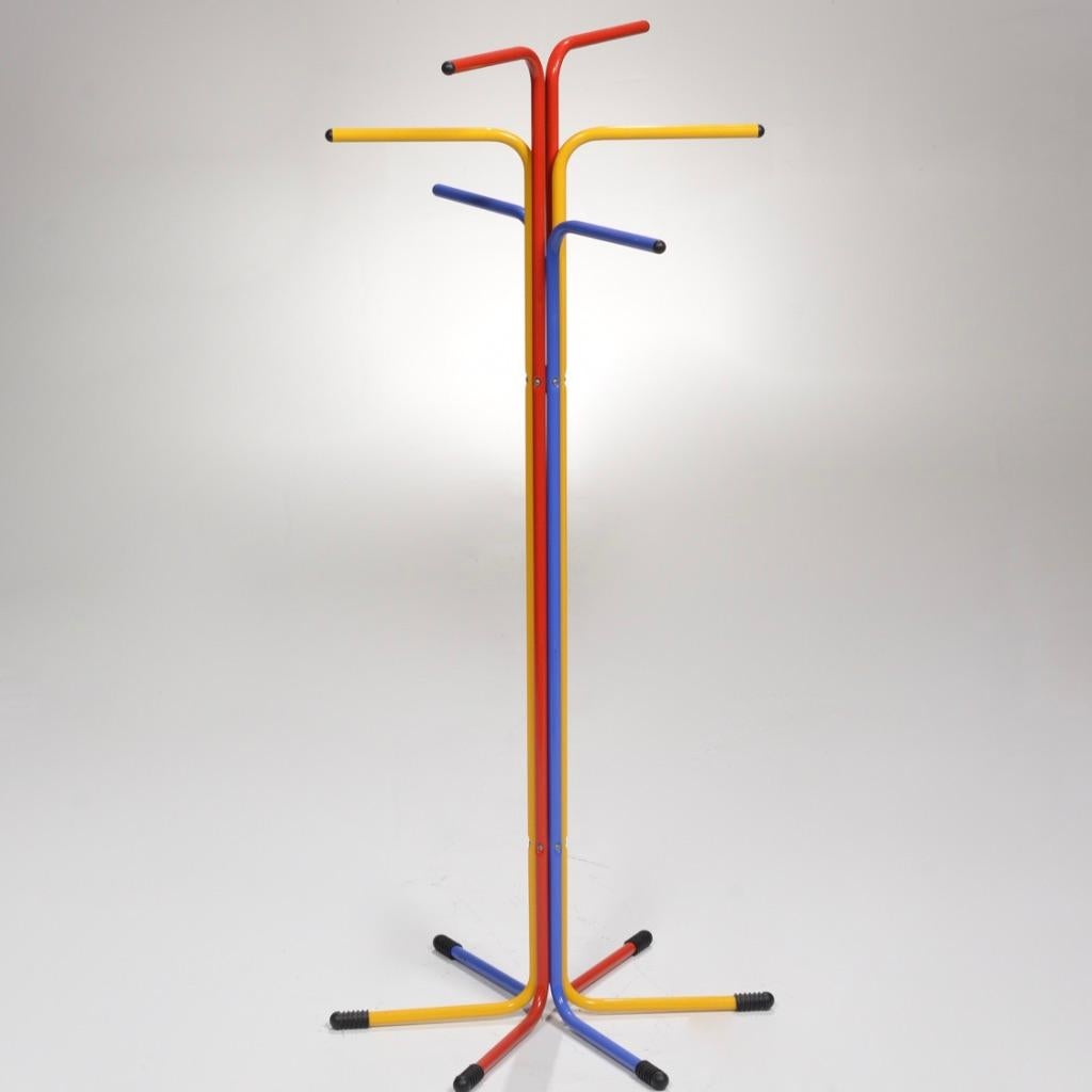 Rare, awesome vintage 1980s Ikea bent metal coat stand. Clean design and fun primary colors. This coat rack features six iron tubes lacquered in yellow, red and blue. Ends are made of a black solid plastic material. Made in Italy. Wonderful