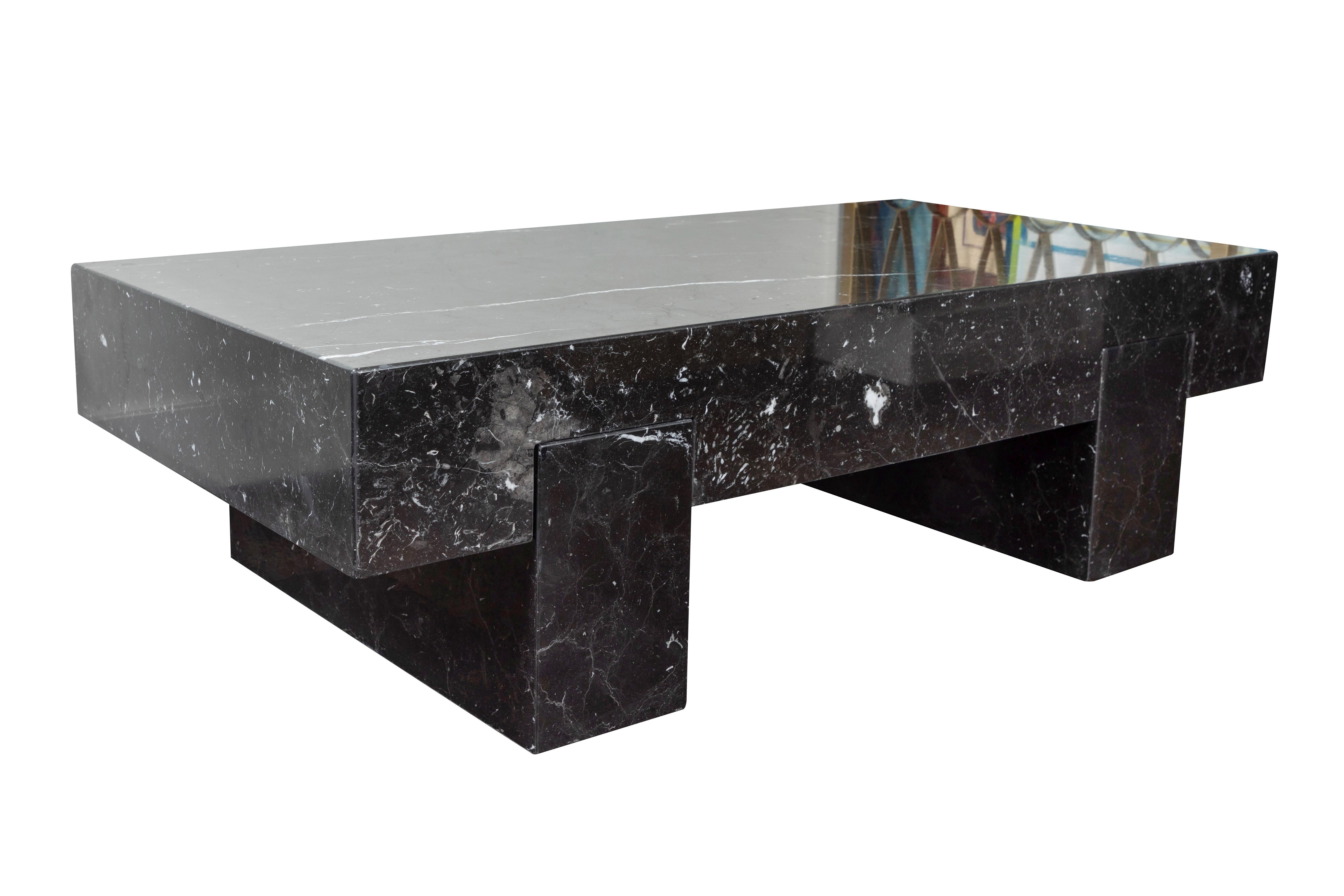Massive, sleek coffee table in Nero Marquina marble, made in Italy, 1980s. Table is constructed of a top portion with slots that set upon two slab legs. Excellent condition, professionally polished.