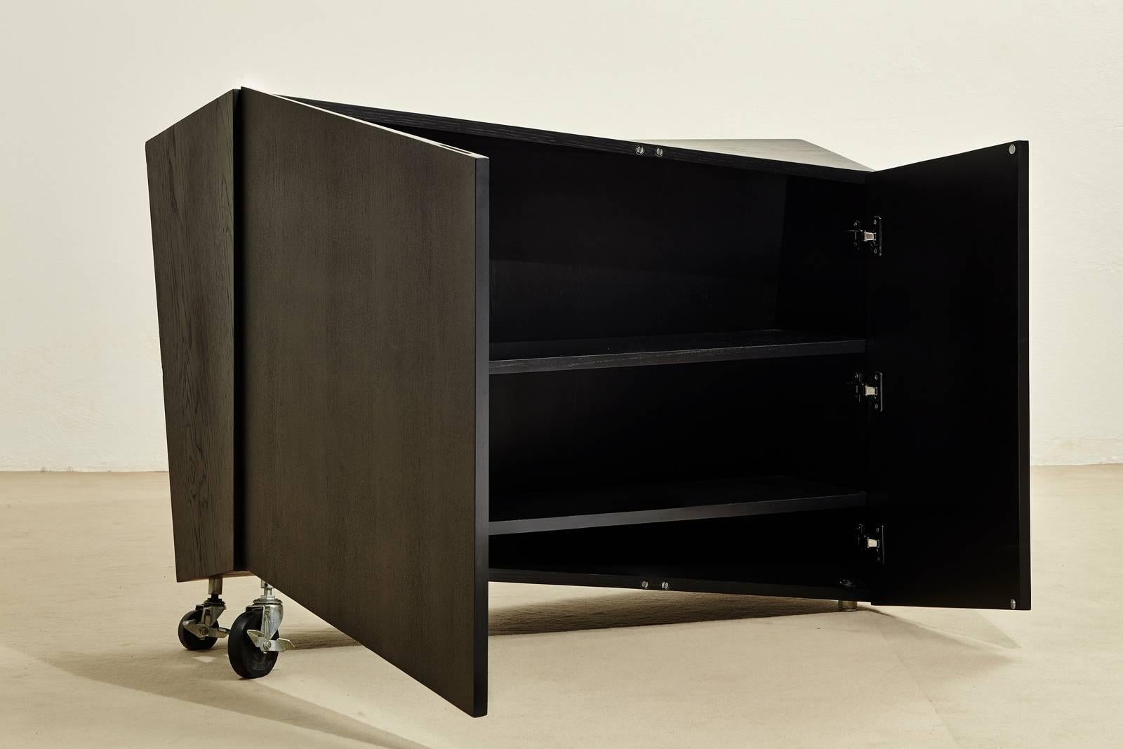 Late 20th Century 1980s Italian Black Wood Asymmetric Two-Door Cabinet Produced by Pallucco For Sale