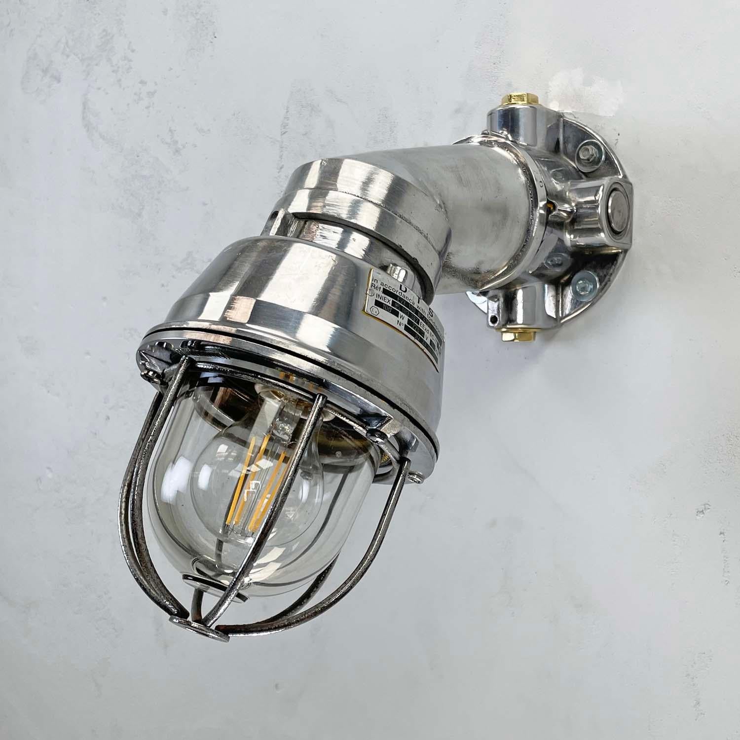 Italian made vintage industrial cast aluminium cantilever wall lighting with tempered glass dome and cage. Add a touch of the industrial to your interior with these large metal wall light fixtures. Reclaimed from Cargo ships and super tankers built