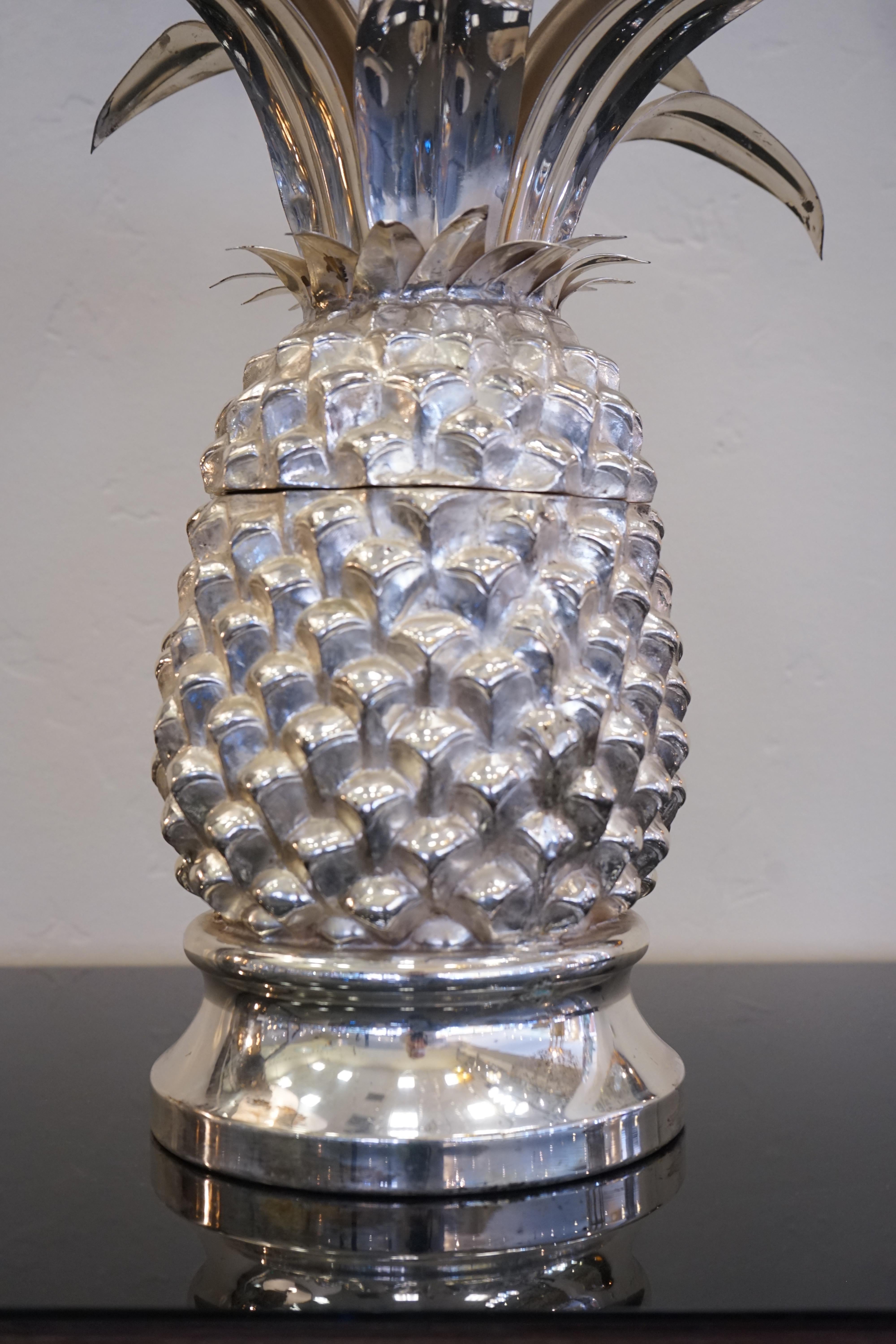1980s Italian chrome large scale pineapple shaped ice bucket. The top of the pineapple opens to reveal an ice bucket but is also a stand-alone art piece when closed.