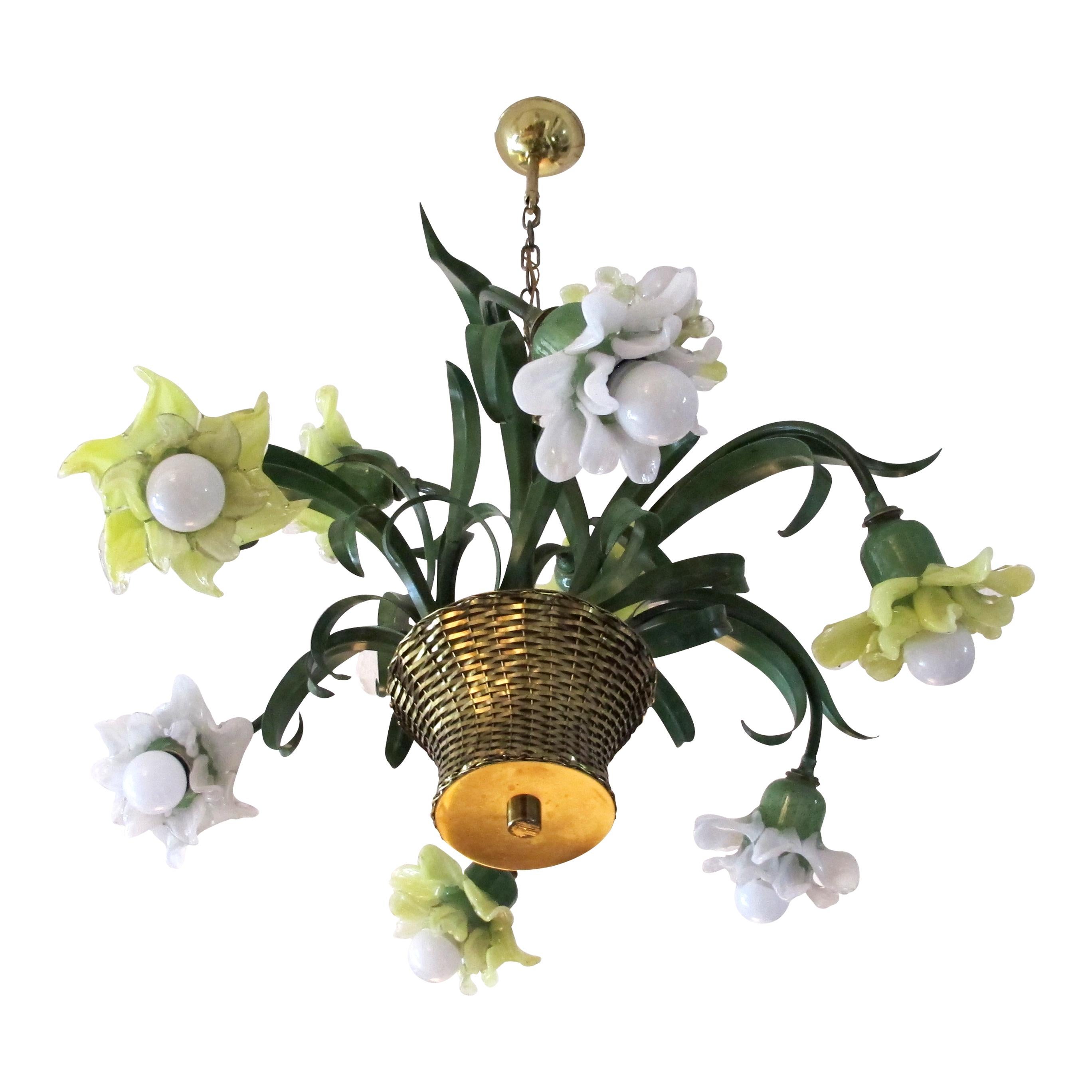 1980s elegant chandelier made by the renowned designer Banci from Florence, Italy. The flowers are handmade with Murano green, yellow and white glass. The chandelier imitates real flowers with metal leaves flowing out of a beautifully made brass