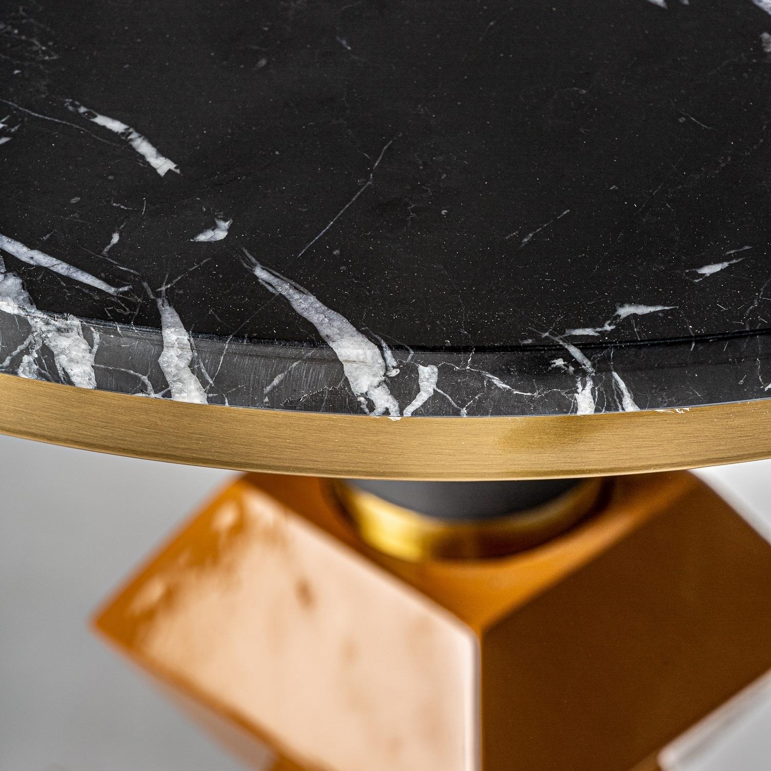 Italian design style round pedestal table consisting of a graphic gilt base, black metal feet adorned with orange touches and a round black marble tray!