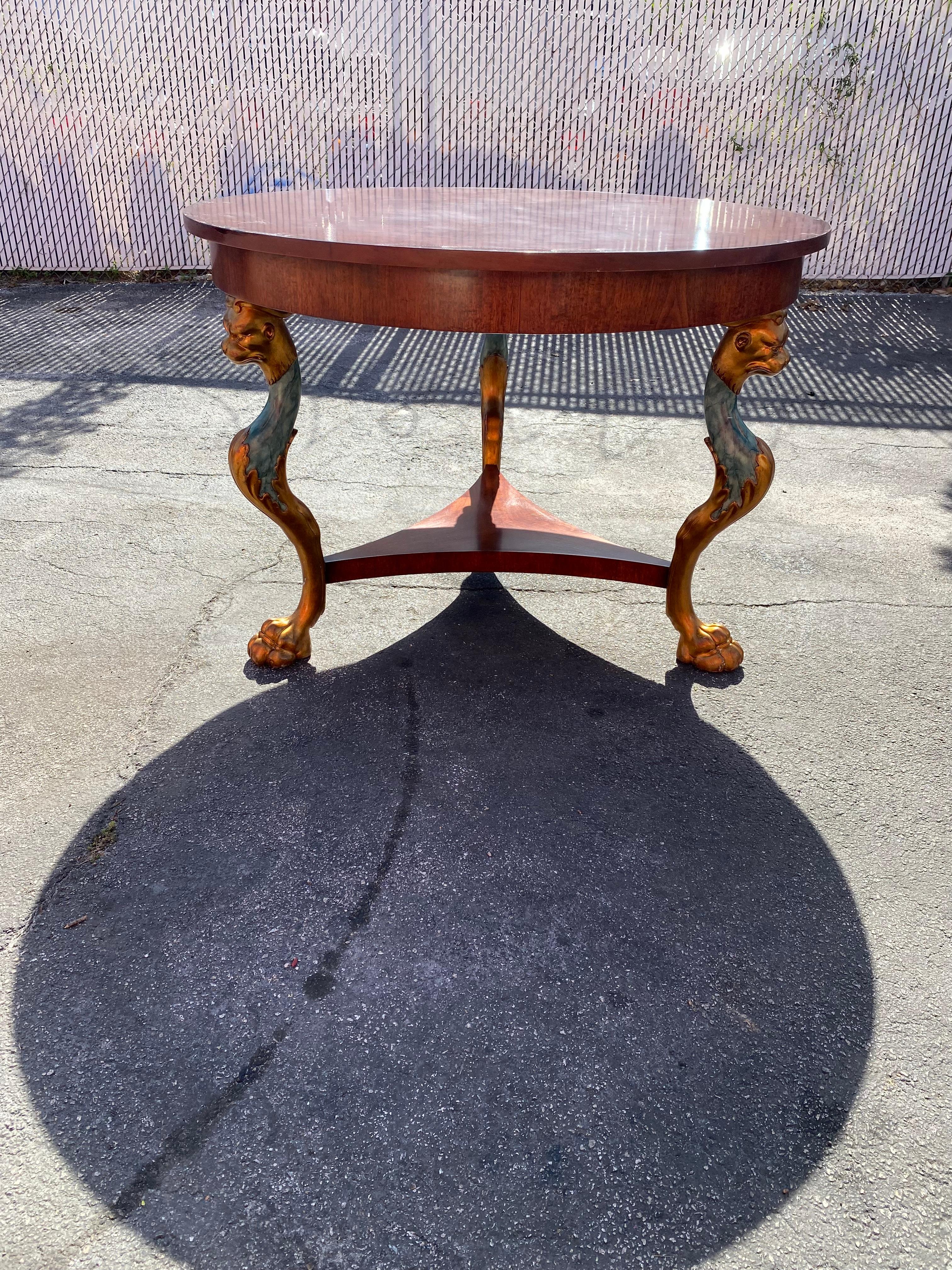 On offer on this occasion is one of the most stunning, rare, center or dining table you could hope to find. Outstanding design is exhibited throughout. Just look at the gorgeous hand carved details on this beauty! The distinctive craftsmanship frame