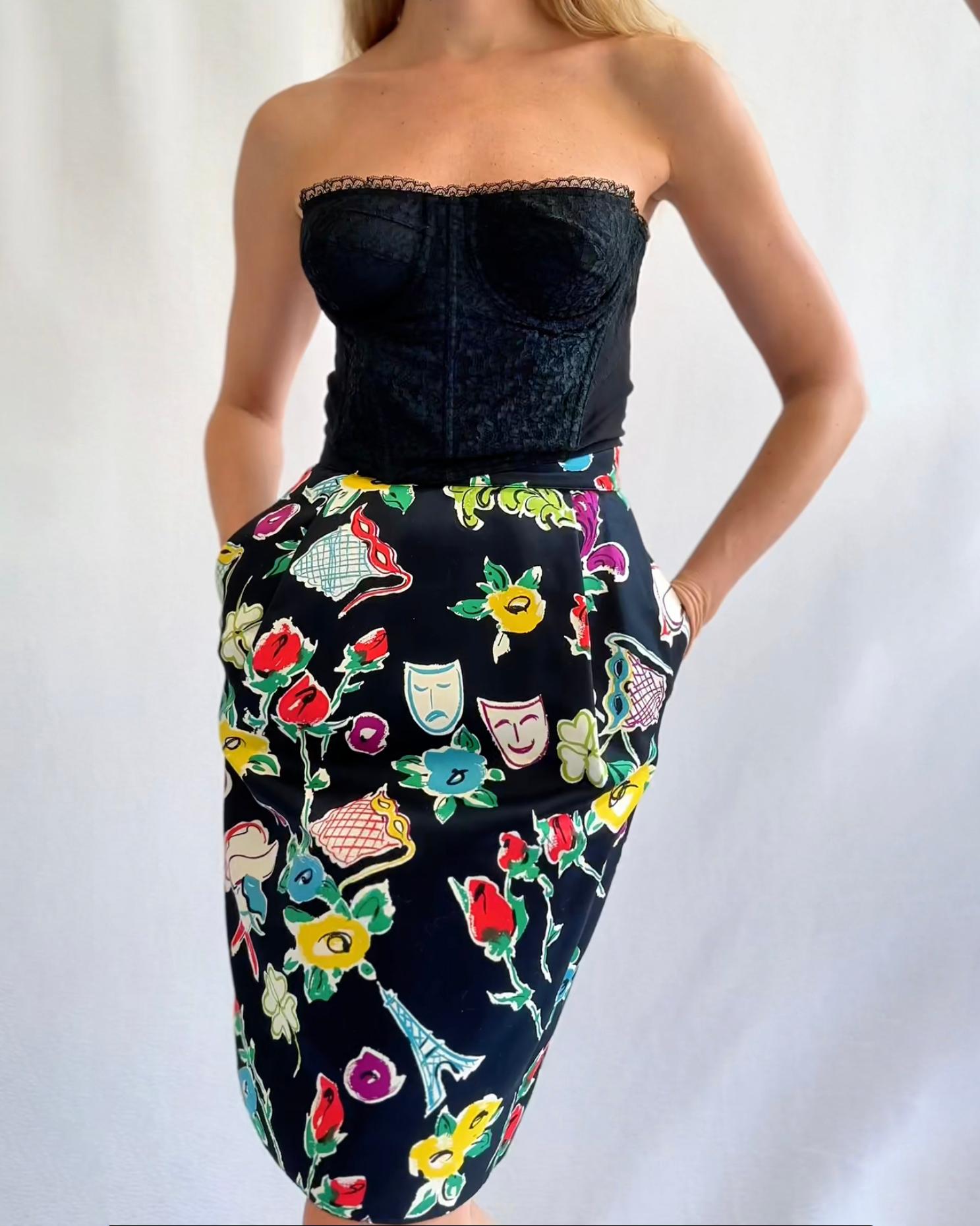 This vintage Christian Lacroix skirt features the most uniquely whimsical print, but the shape makes it quite versatile. Made in the 1990s, it features a print of florals, Eiffel Towers, opera glasses and masks, in a great colorful palette that