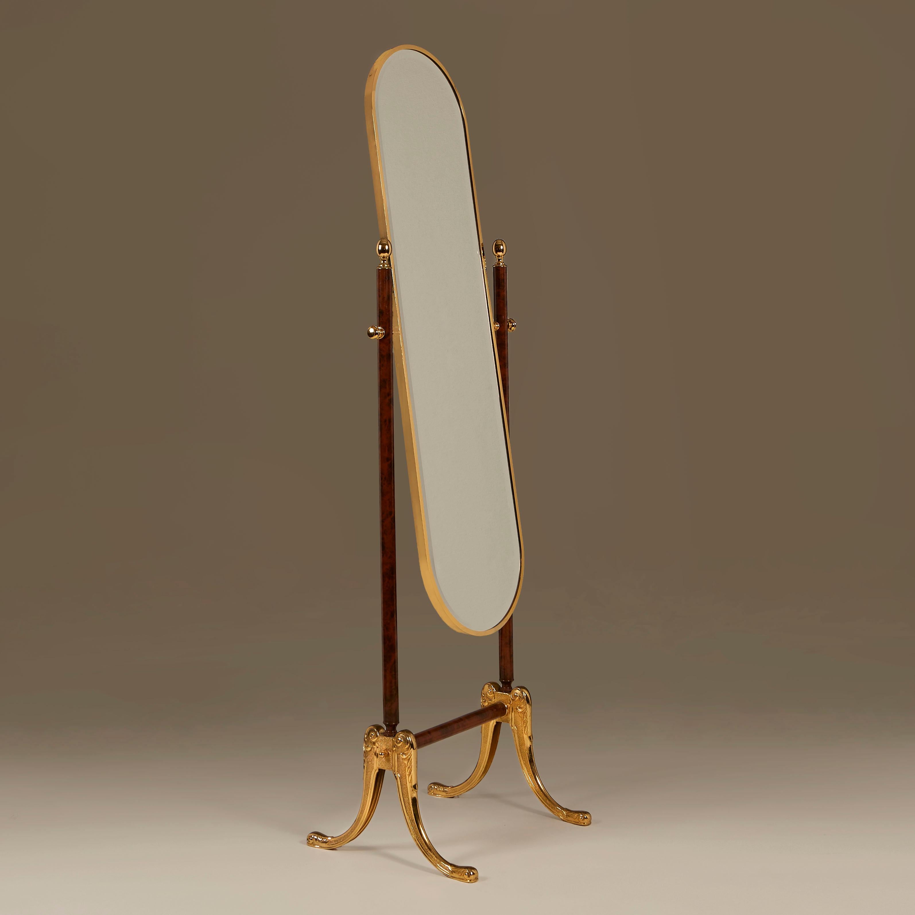 Chic dark faux wood and lacquered brass full-length adjustable bevelled glass mirror with intricately-detailed cast brass splayed legs (see detailed image).