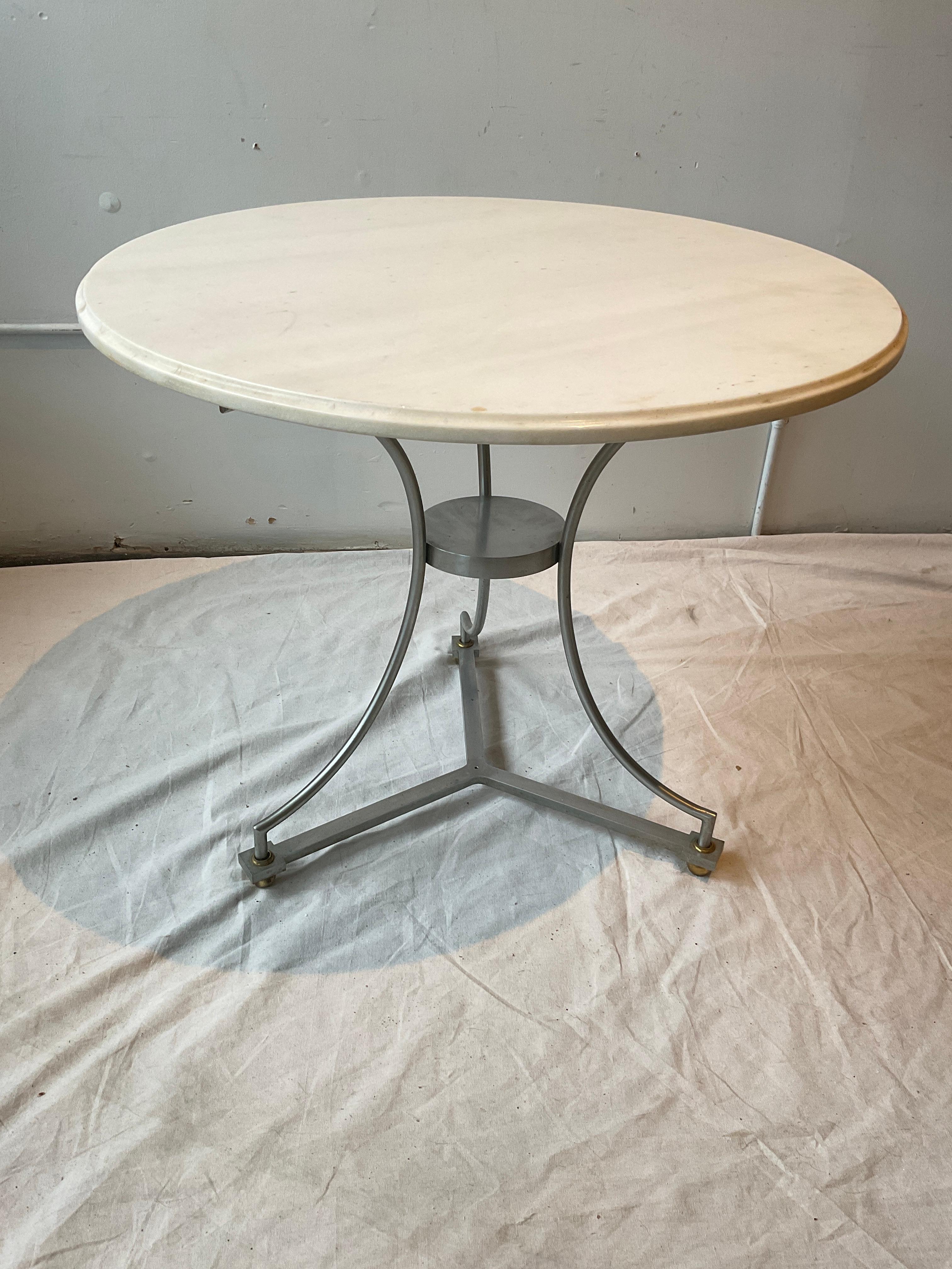1980s Italian Gueridon table. Beveled marble top.
There’s a hole on the bottom of the base that might have once had  a brass finial in it?