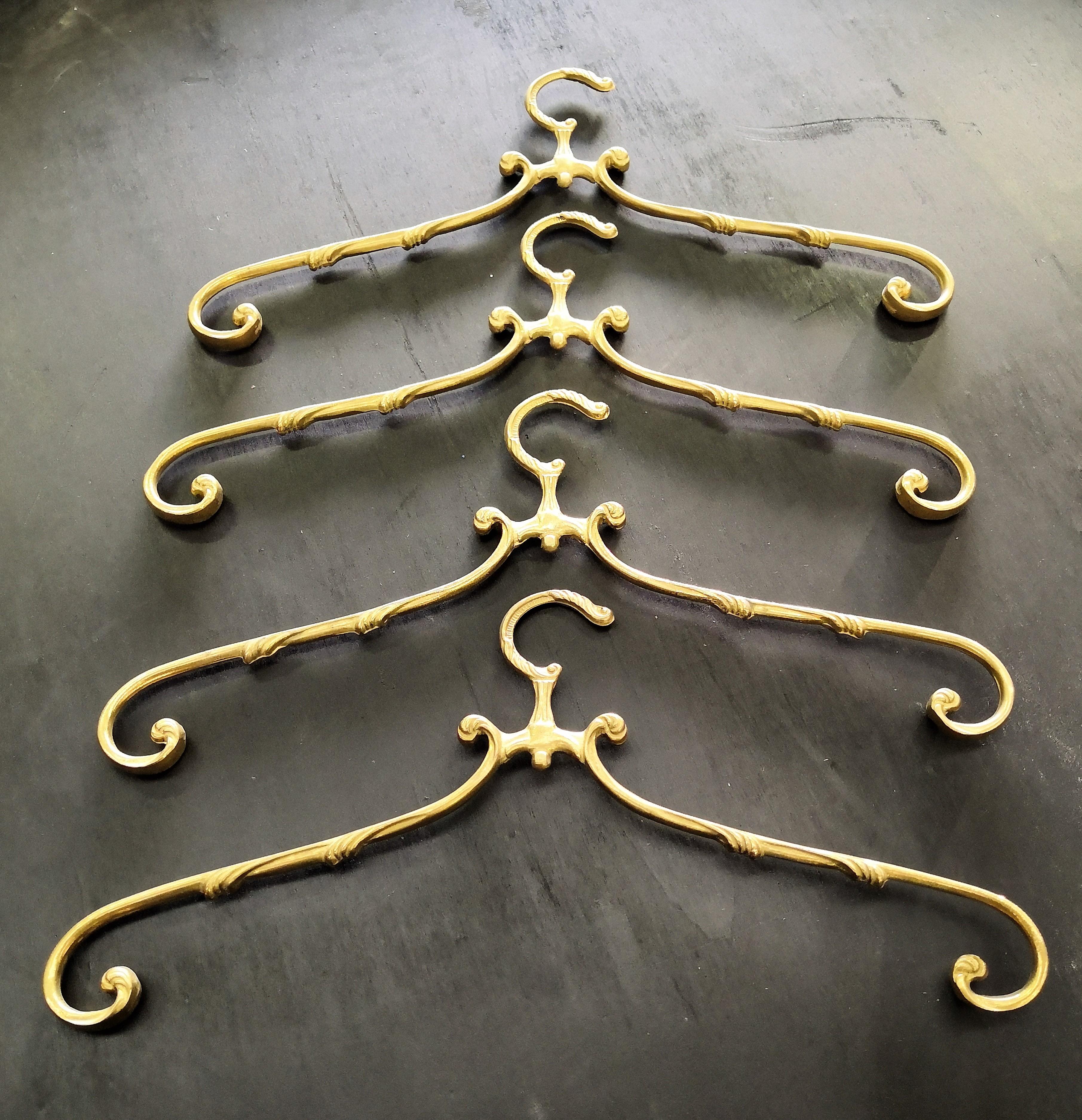 1980s Italian Hollywood Regency neoclassical solid brass coat hangers, large stock available coming from one of Italy's main brass producers of late 20th century, the brass is in excellent conditions, never used with beautiful slight patina of time,