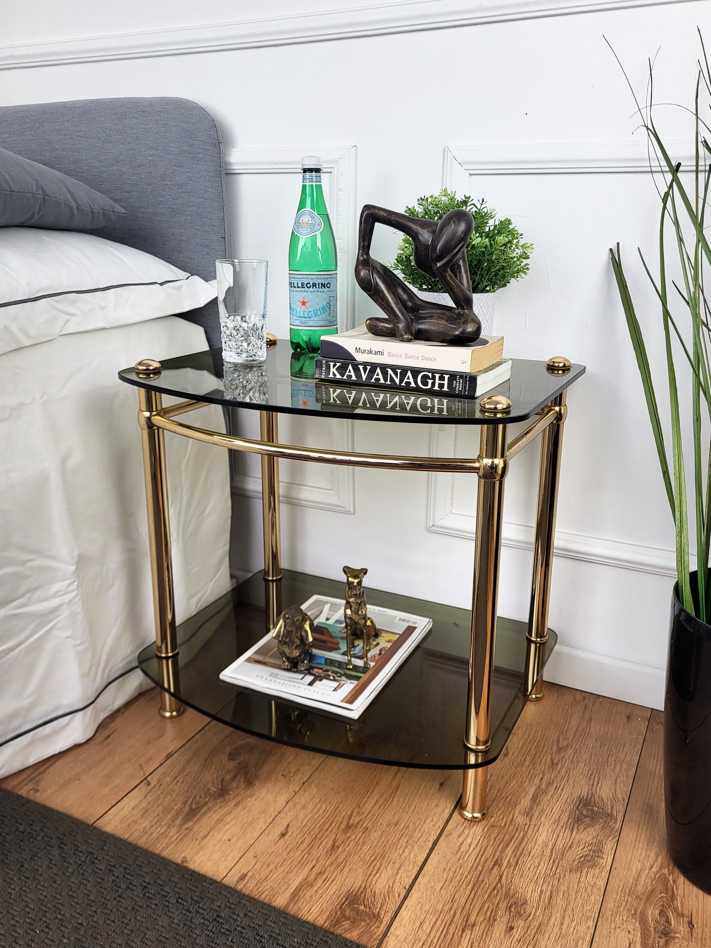 Beautiful brass and glass side tables, manufactured in the 1980s in Italy. The tables have two glass shelves on the gilt brass structure. The conditions are excellent. As can be seen from the pictures. A great pair that perfectly adds to every home
