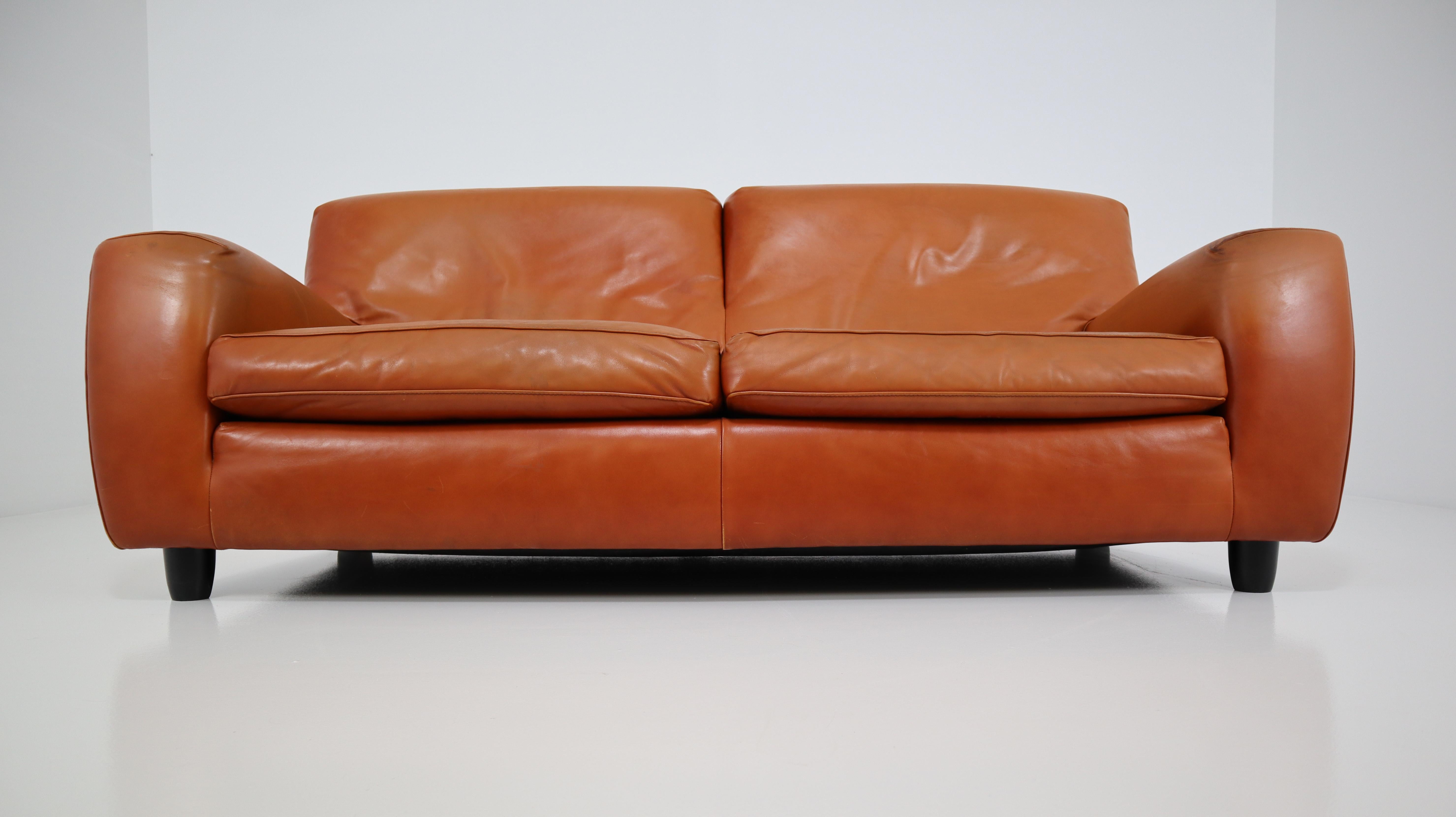 Big and comfortable natural Cognac bull leather sofa named 'Fatboy' handmade by the Italian company Molinari in the 1980s. The bulls leather is very thick and has a nice used patina.