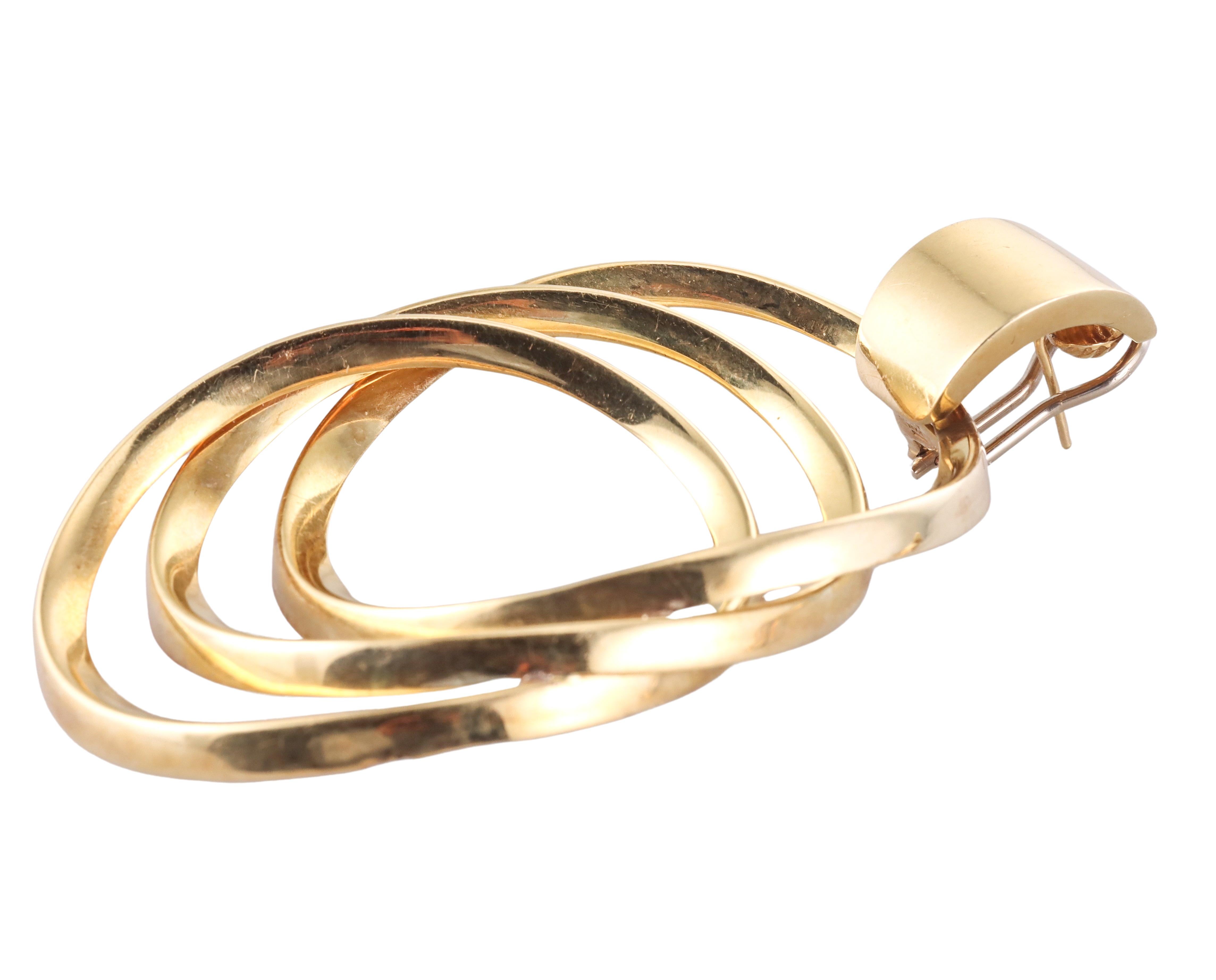 Whimsical circa 1980s 18k gold Italian made earrings, featuring three interlocked circles.  The earrings measure 3.25
