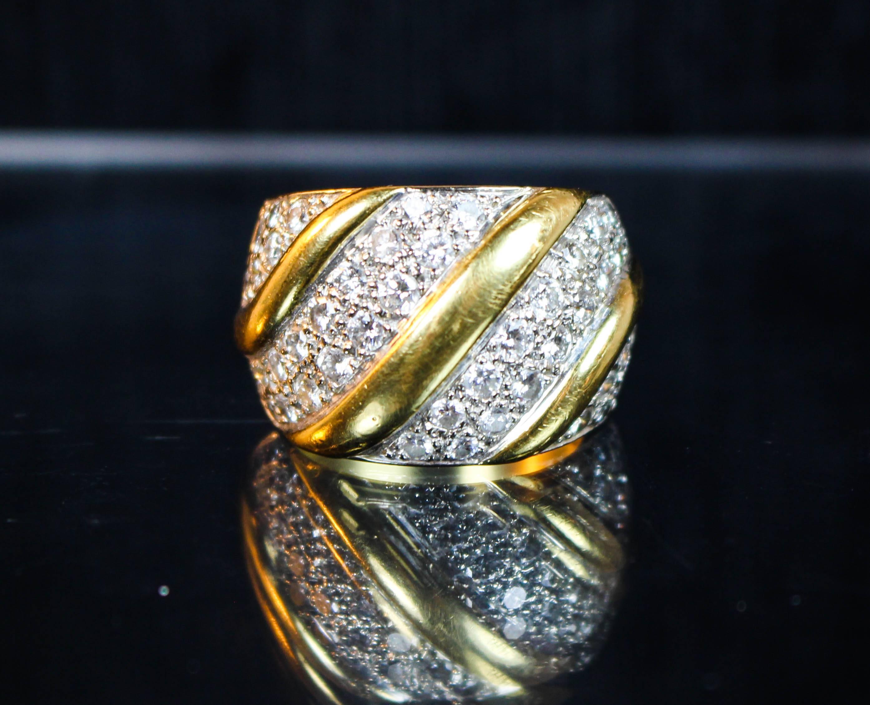 This ring is 18 Karat yellow and white gold, with pave cluster diamonds. 1980's Italian, stunning Day to Evening design. Specs below. In excellent condition, with very minor wear to the back of the band which a little professional buffing would