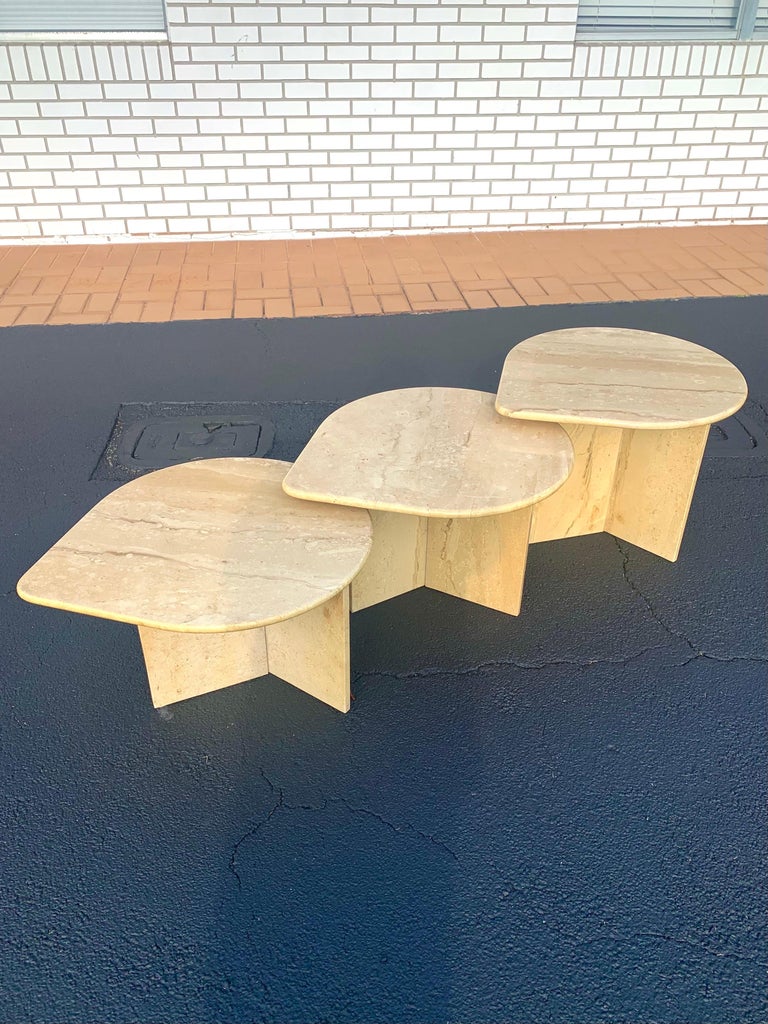 Gorgeous set of modular travertine tables. Authentic Italian design and marble from the late 20th century. Travertine has beautiful figures and veining throughout. 

Three separate tables at 18.5”, 16.5” , and 14.5” height. Each top is 23.5