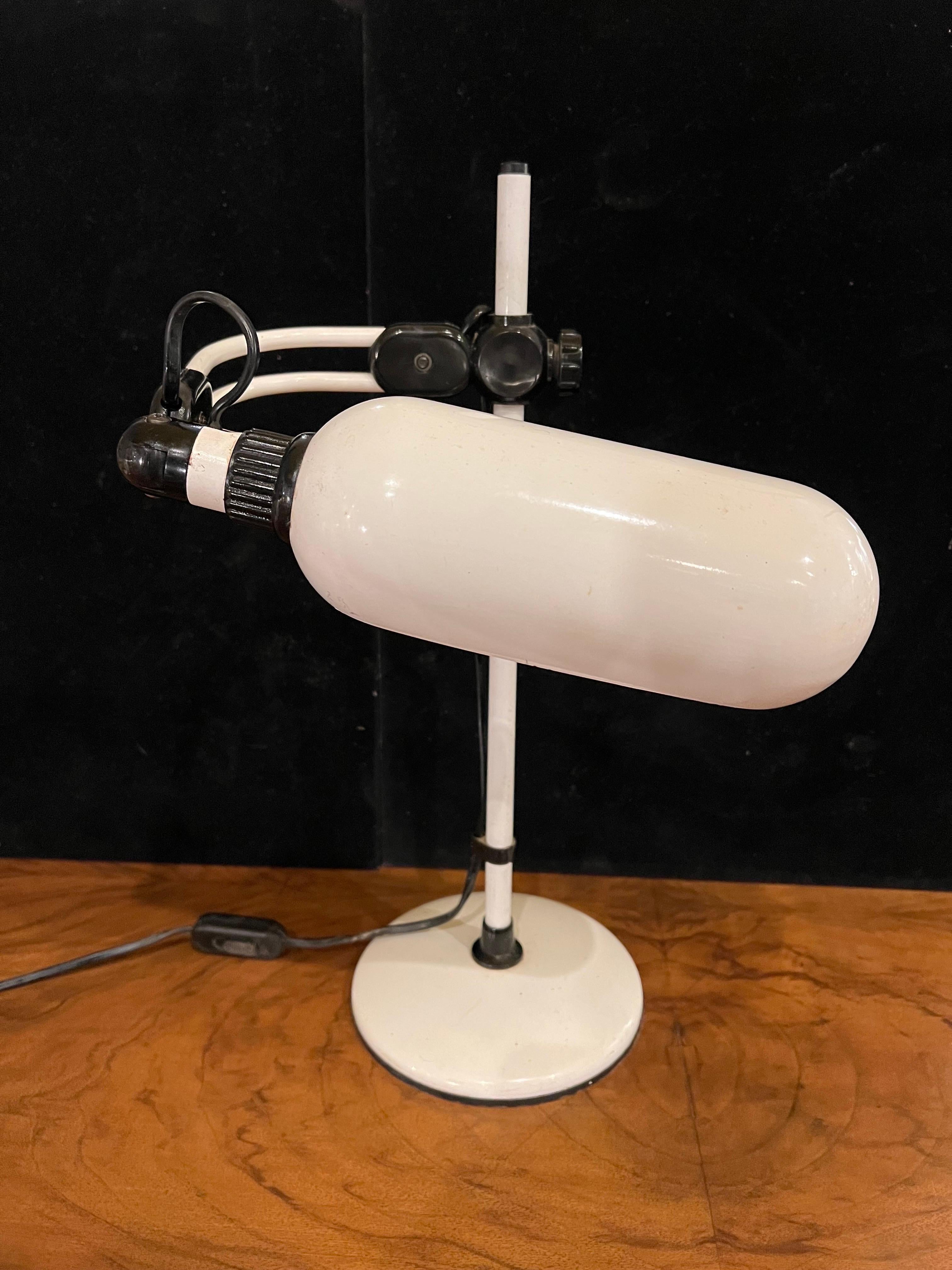 Rare postmodern Italian design, multidirectional table desk lamp enameled white metal finish with plastic fittings, circa 1980's in great condition in many different positions.