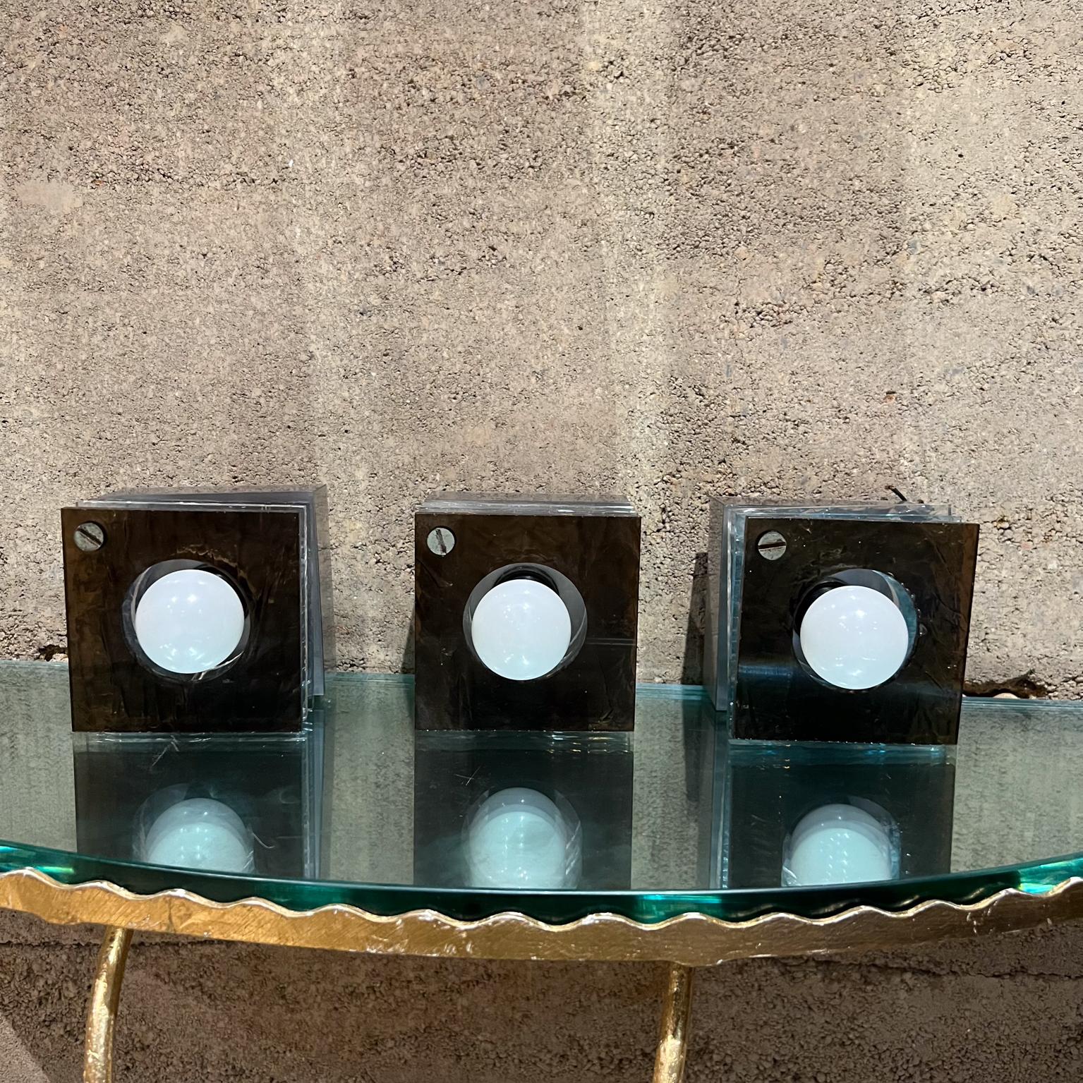 
Three (3) Modern Italian Wall Sconce Squares in multicolored texture plastic & plexiglass 
after Artemide Italy 1980s
4h x 4w x 3 .5d inches.
Requires three E-14 bulbs (not included)
Original Unrestored Preowned Vintage Condition.
Wear consistent