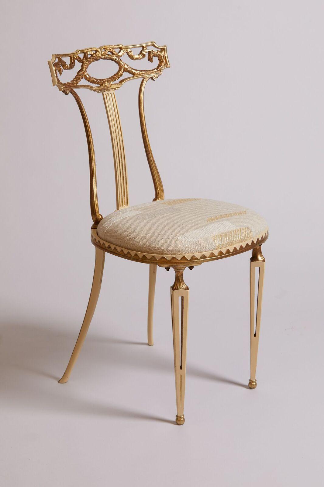 1980s Italian gold stamped metal and cream reupholstered and restored Palladio neoclassical chair.