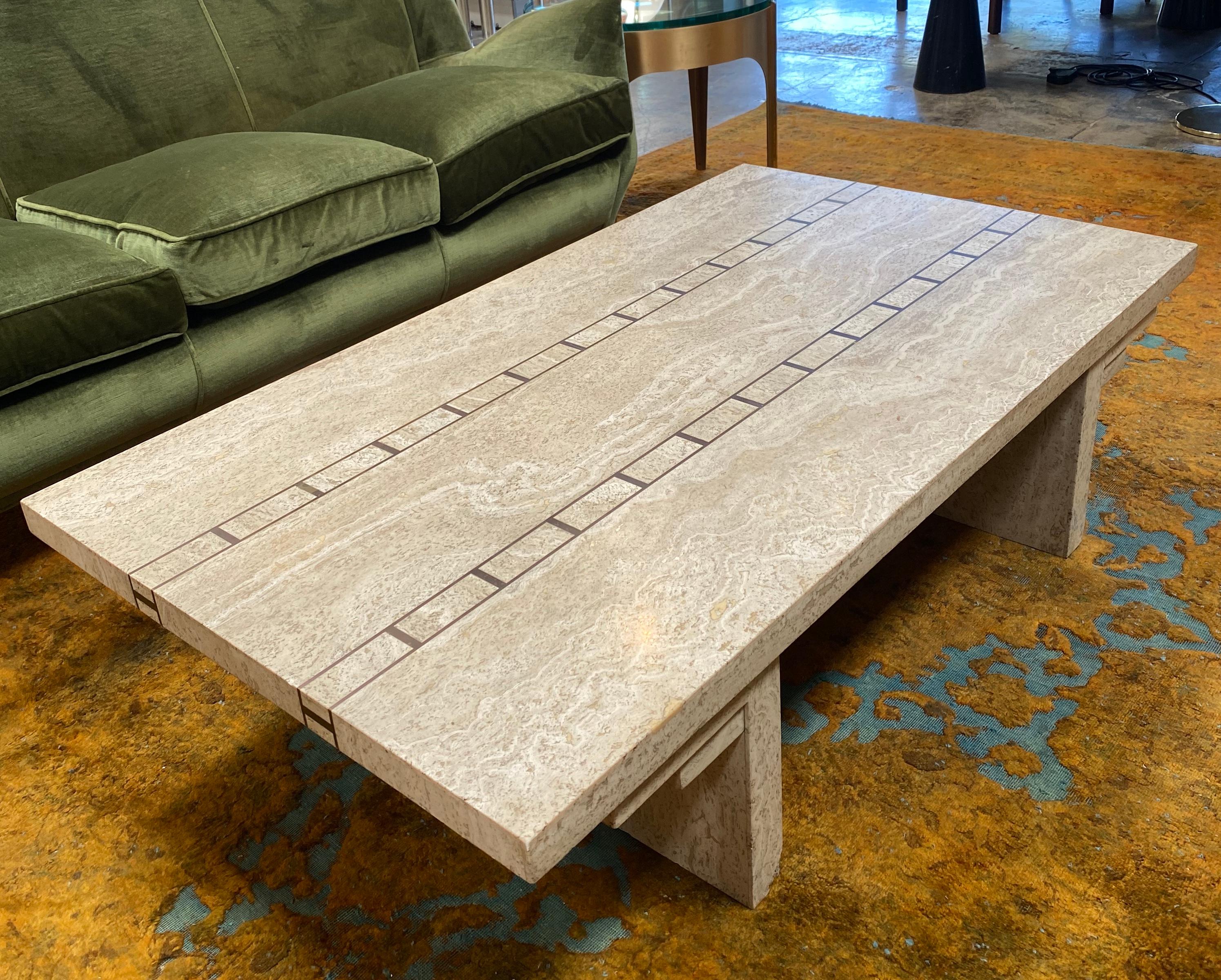Beautiful and elegant Italian travertine coffee table with brass details.
    