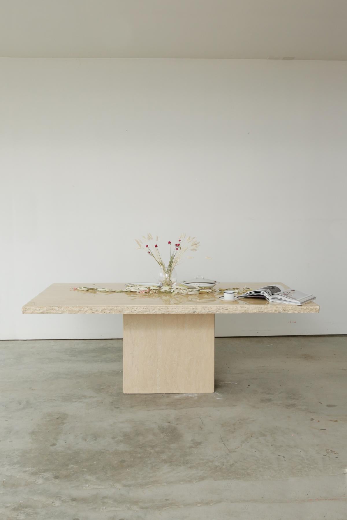Mid-Century Modern Italian travertine live edge dining table is one of the grandest, yet subtle dining tables you can find. It has a beautiful live edge which brings the best beauty of Travertine. You can enjoy the visual satisfaction that comes