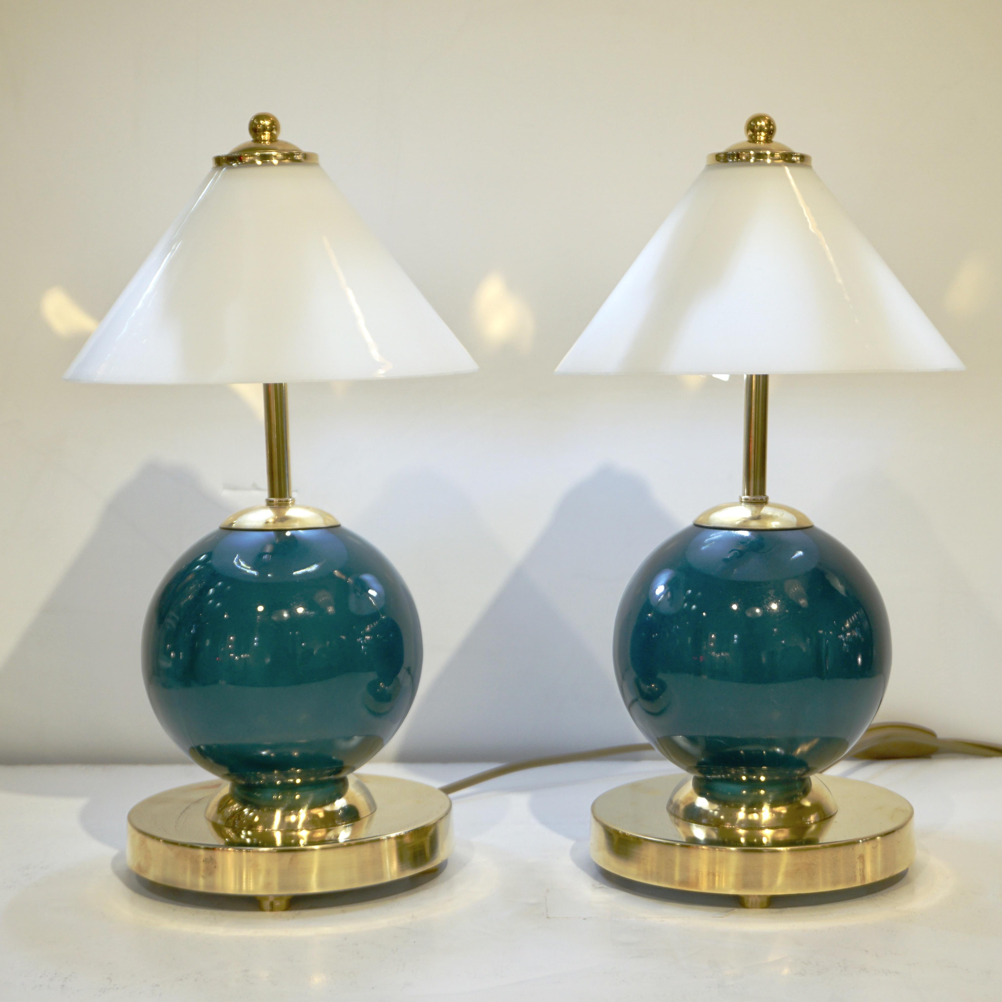 A one-of-a-kind unusual and delightful pair of lamps, entirely handcrafted in Italy, their size makes them ideal for nightstands in bedrooms or on a desk. The central sphere, in Murano glass with a green color to look like jade, sits on a double
