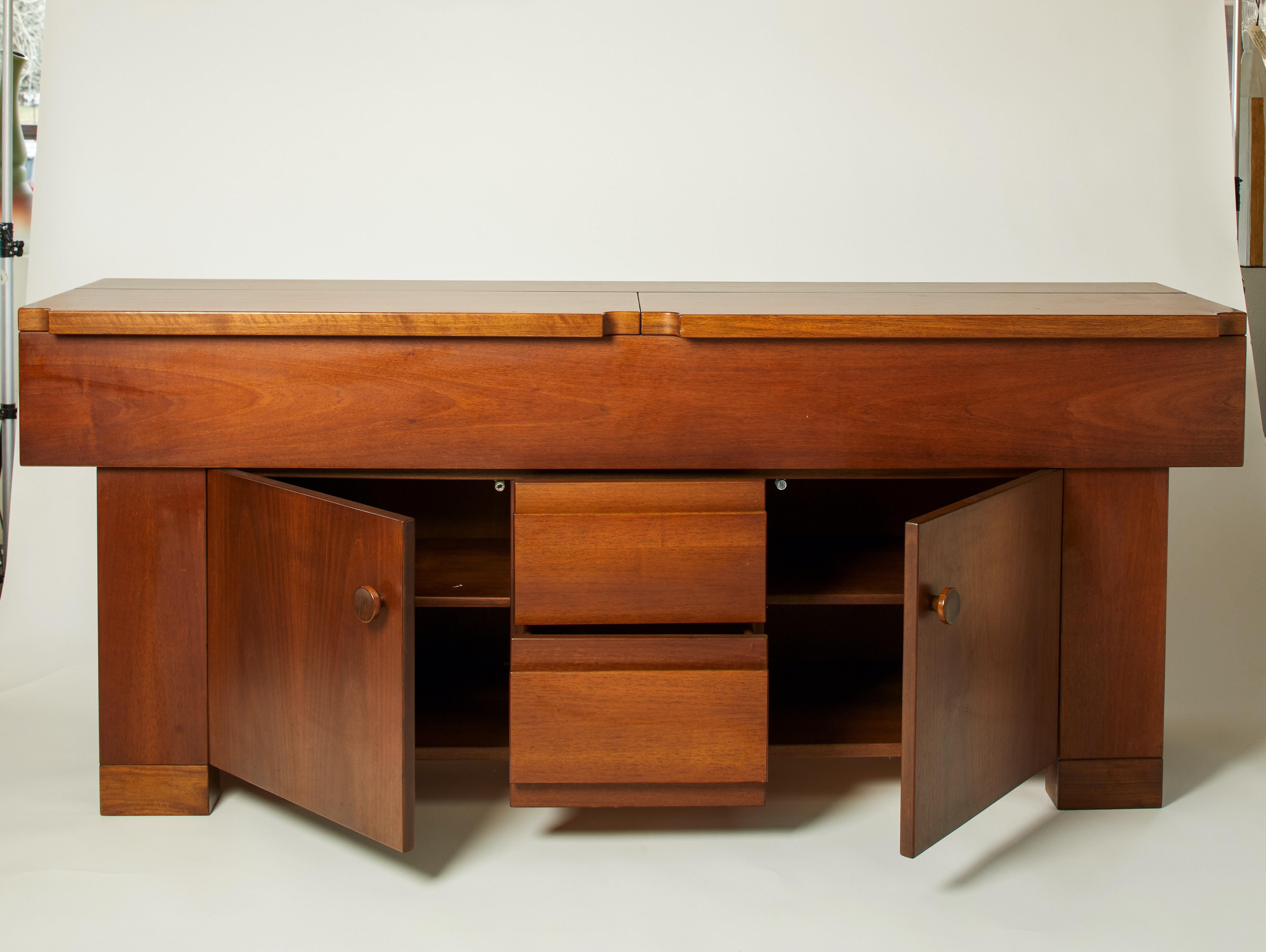 1980s Italian walnut buffet featuring a multitude of shelves and drawers.