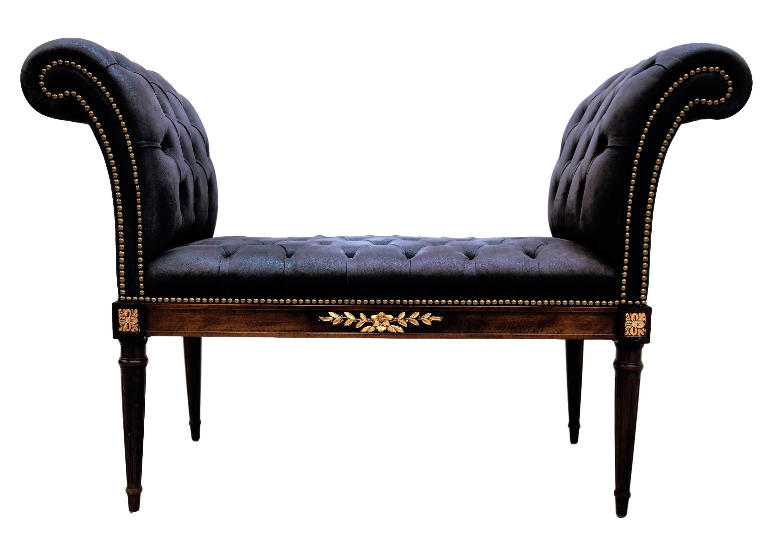 Crafted in Italy, this traditional French Louis XVI and neoclassical style banquette, window seat or daybed features rolled arm curved sides, the typical carved and tapered legs with golden leaf giltwood decoration medallions at each corner and in